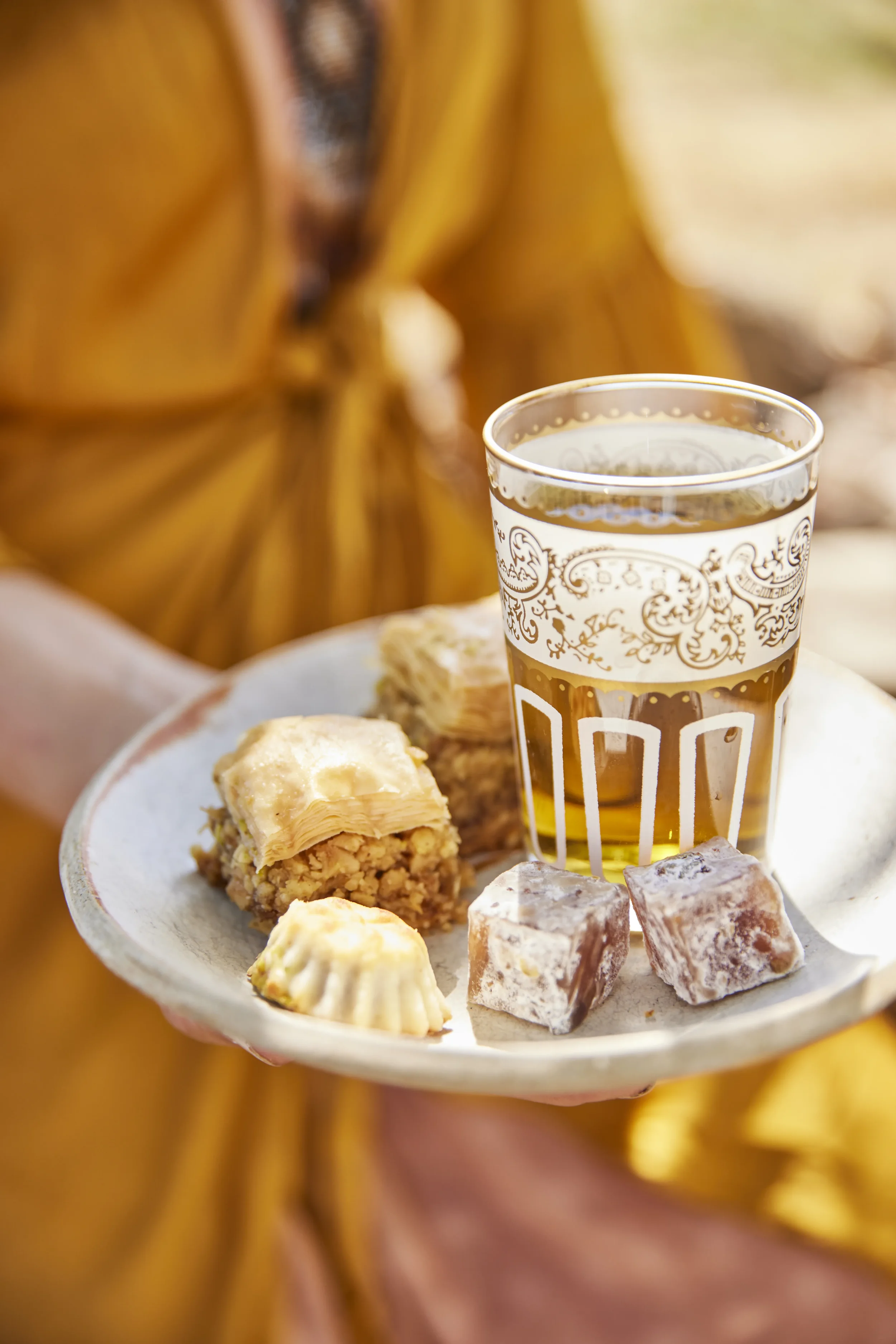 House-made Rôtie baklava served with tea — pistachios, walnuts, and honey