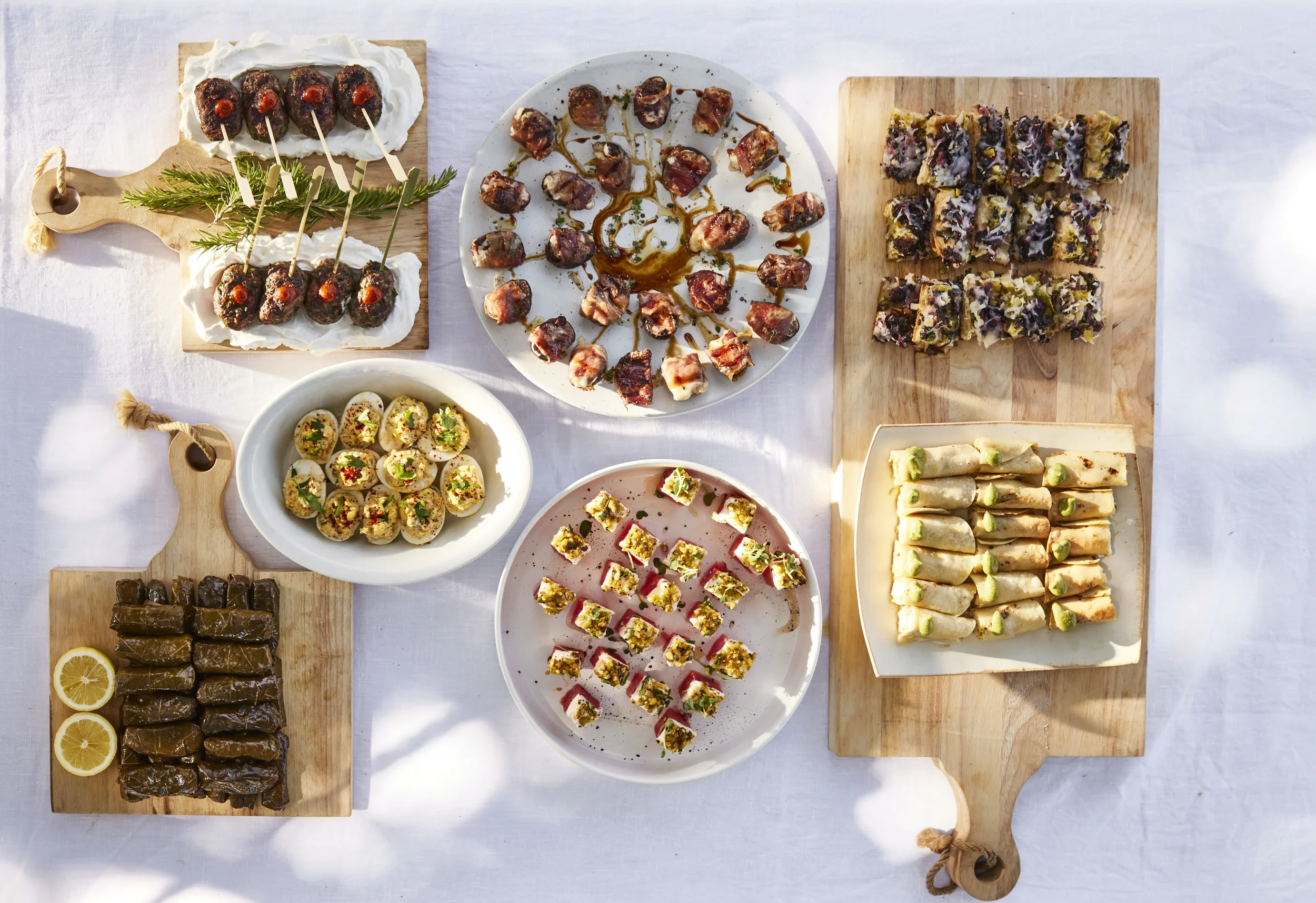 Ojai Rôtie catering sweets — house-made baklava and bite-sized desserts on a wooden board