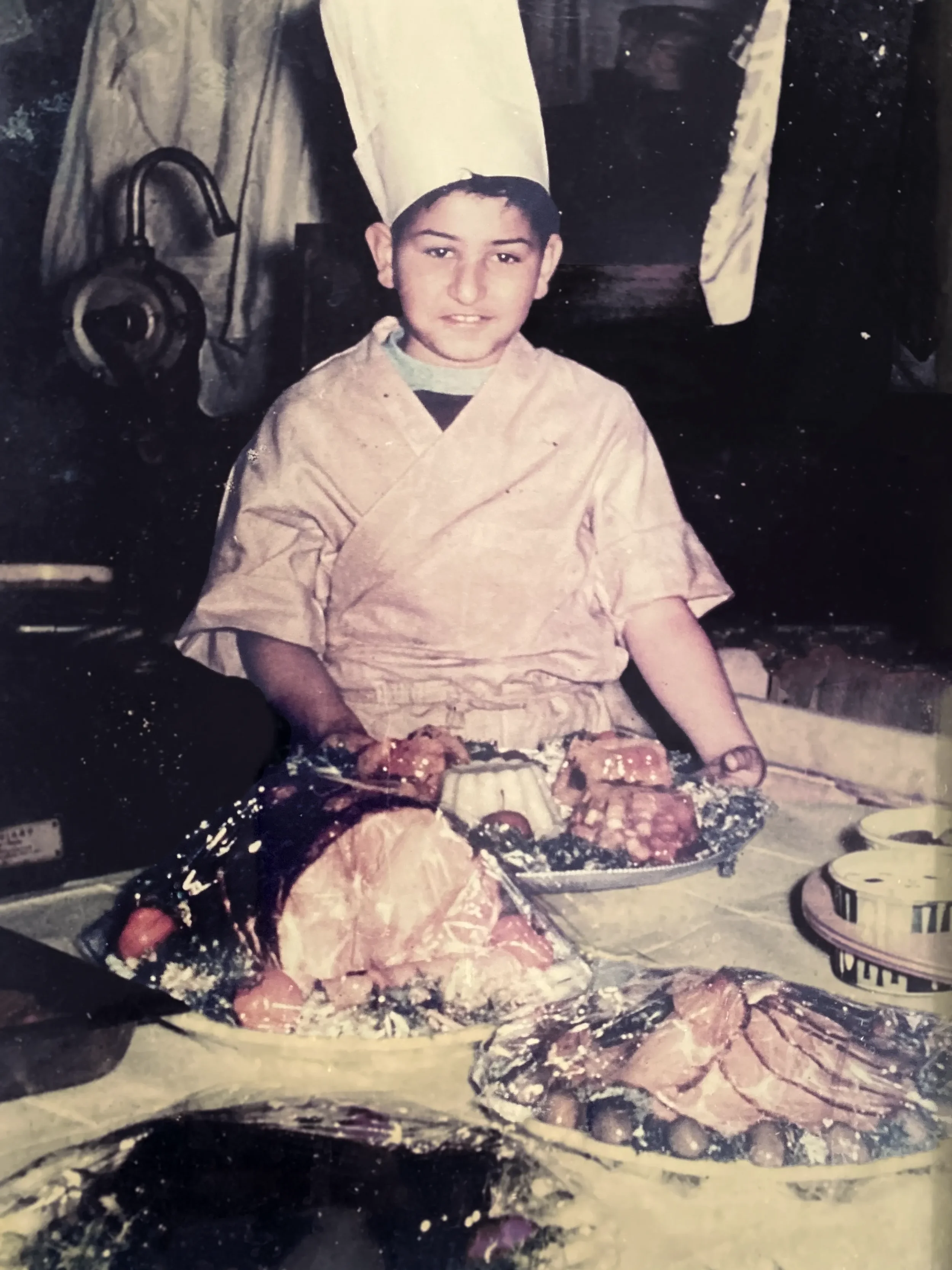 A young Larry Nicola learning the craft at his family's Silver Lake meat market, the roots of Ojai Rôtie