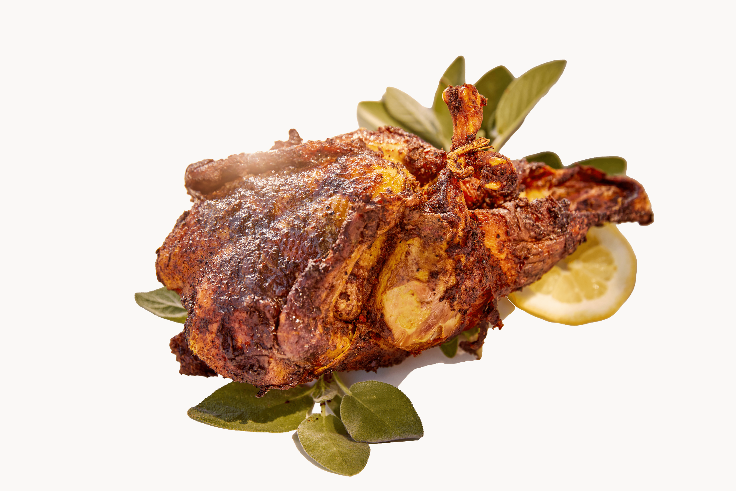 Whole rotisserie chicken at Ojai Rôtie — pasture-raised, seasoned with house spice blend, Carpinteria California