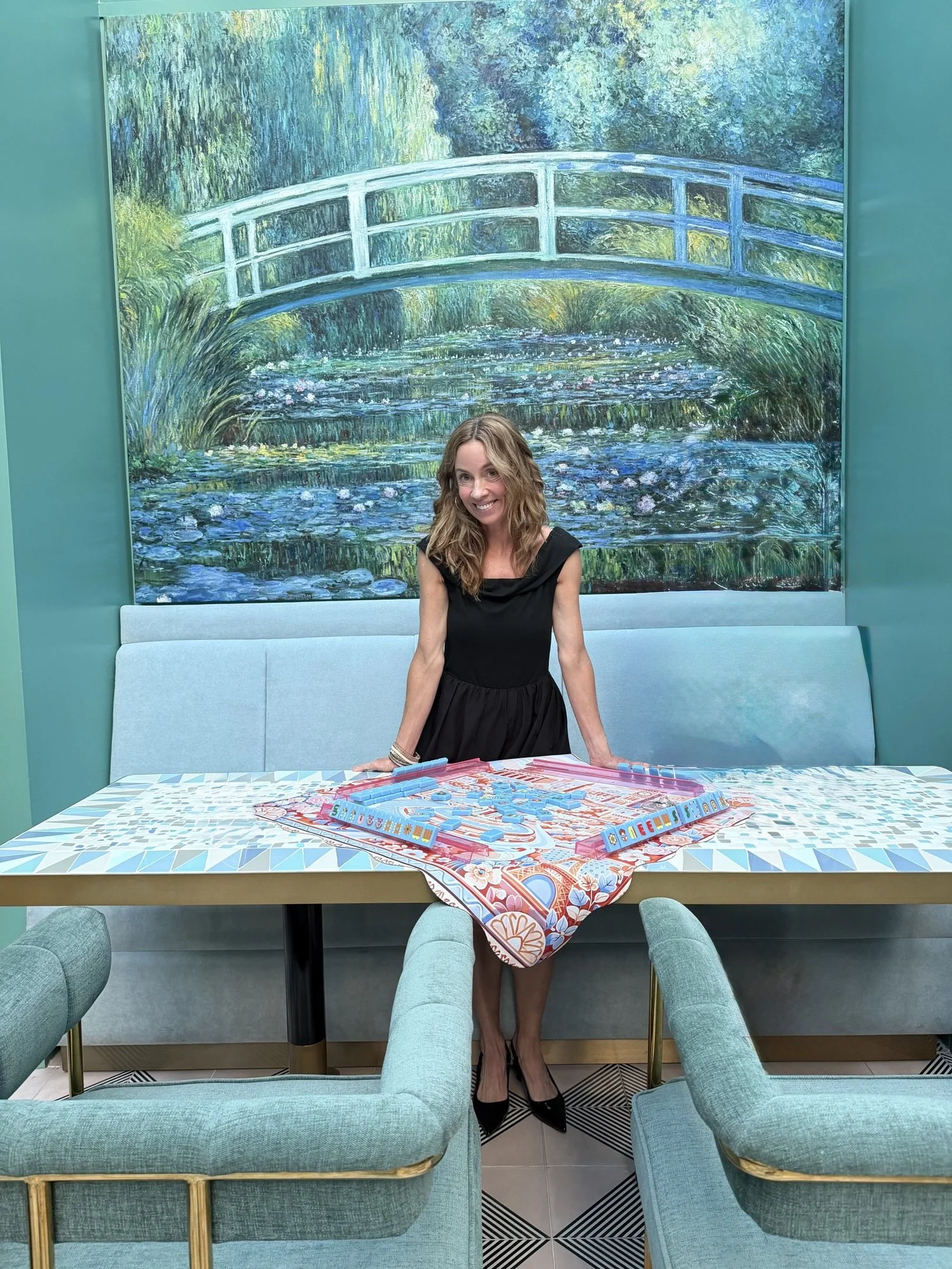 Laurie at a styled mahjong table at Jupiter Supper Club in Austin