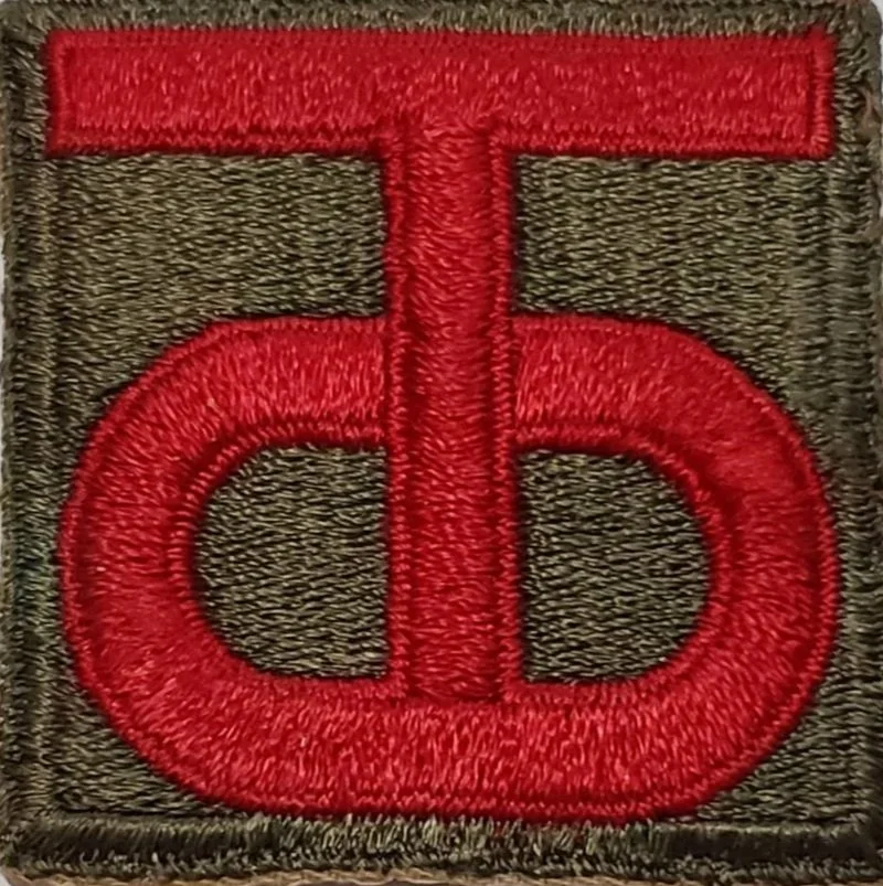embroidered patch with a large red Greek letter Phi on a black background.