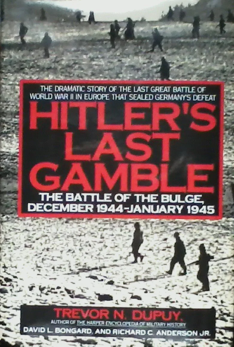 Book cover titled "Hitler's Last Gamble" with a black and red design. The subtitle discusses the Battle of the Bulge during December 1944 to January 1945, and the background features soldiers walking through a snowy landscape.