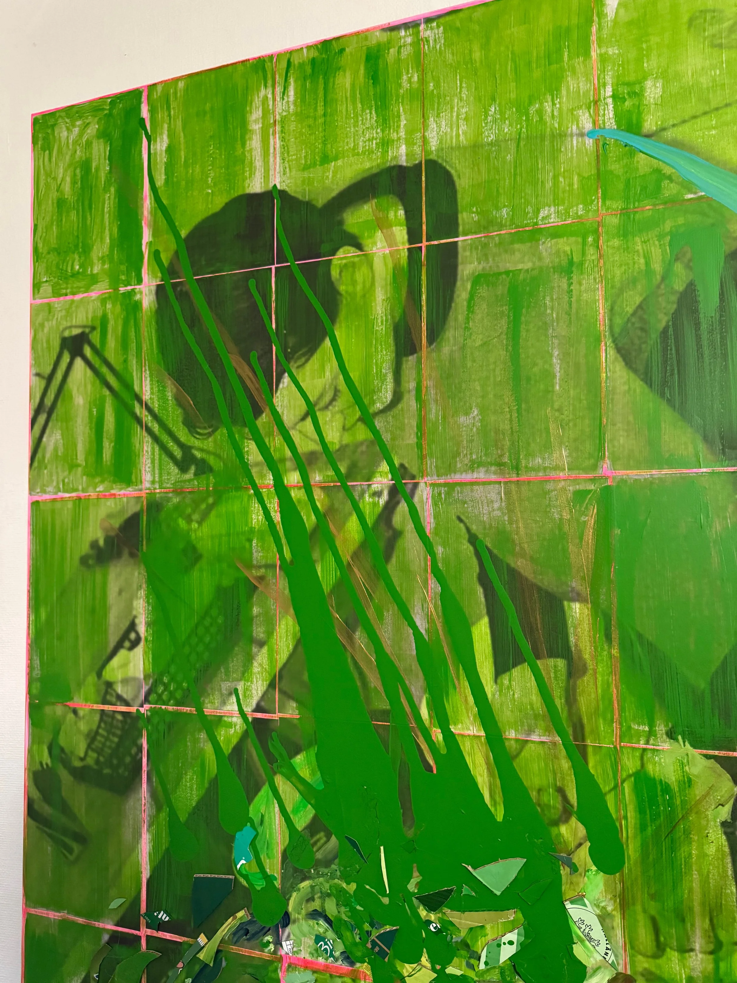 A shadow of a person taking a photo is cast on a green wall with pink grid lines, while green paint drips down from the top.