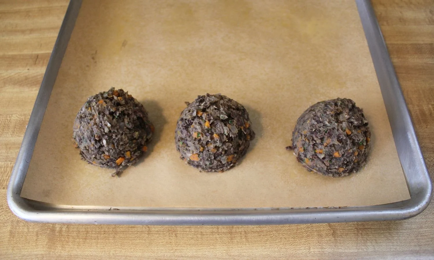 scoops of black bean and lentil cakes
