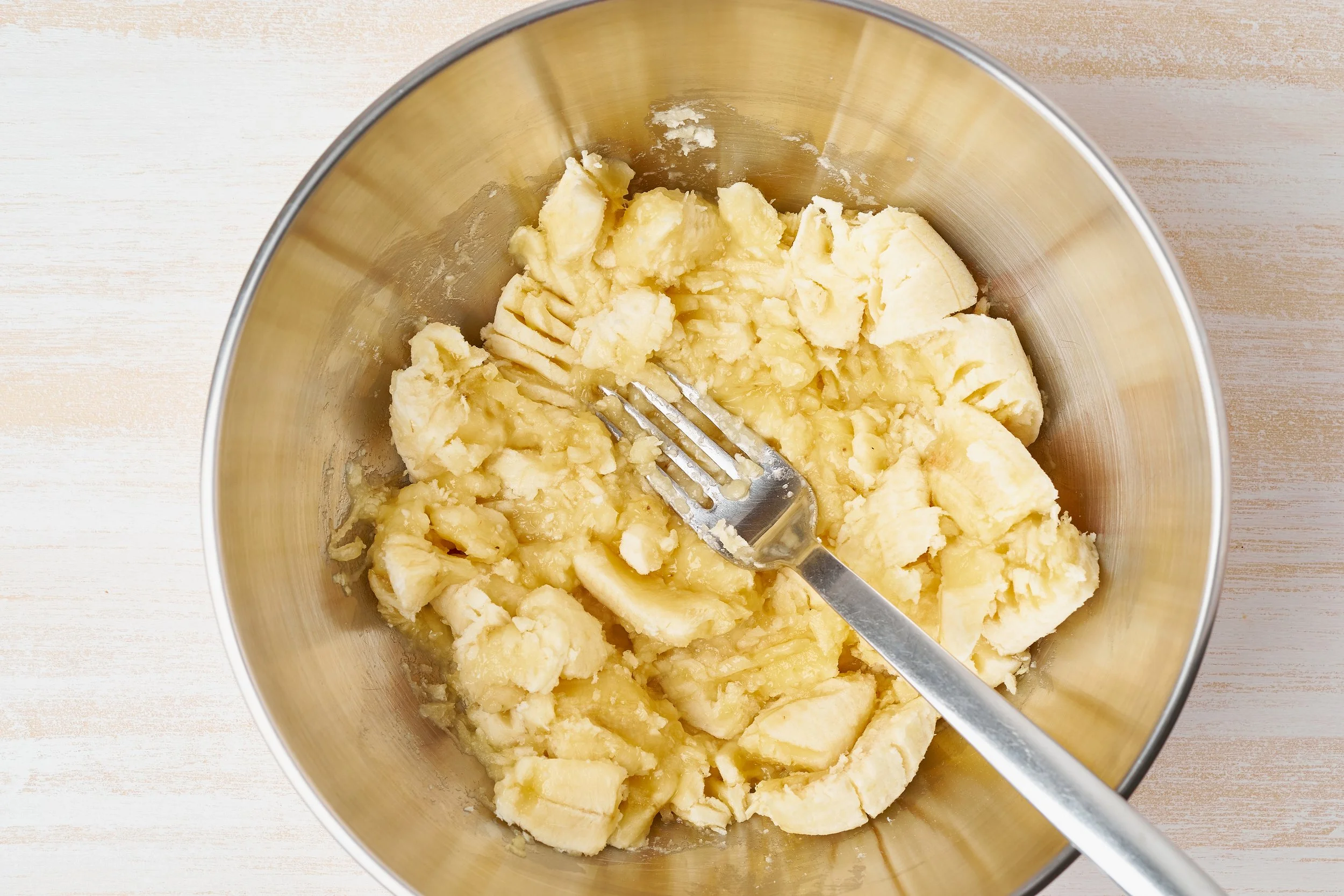 Mashed Banana in bowl for egg free baking
