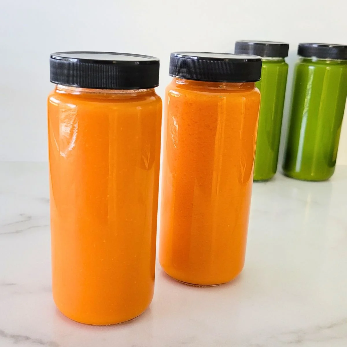 jars of fresh orange and green juice