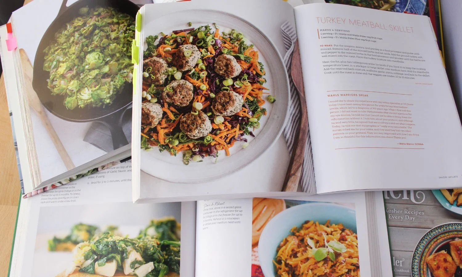 stack of cookbooks open to show recipes