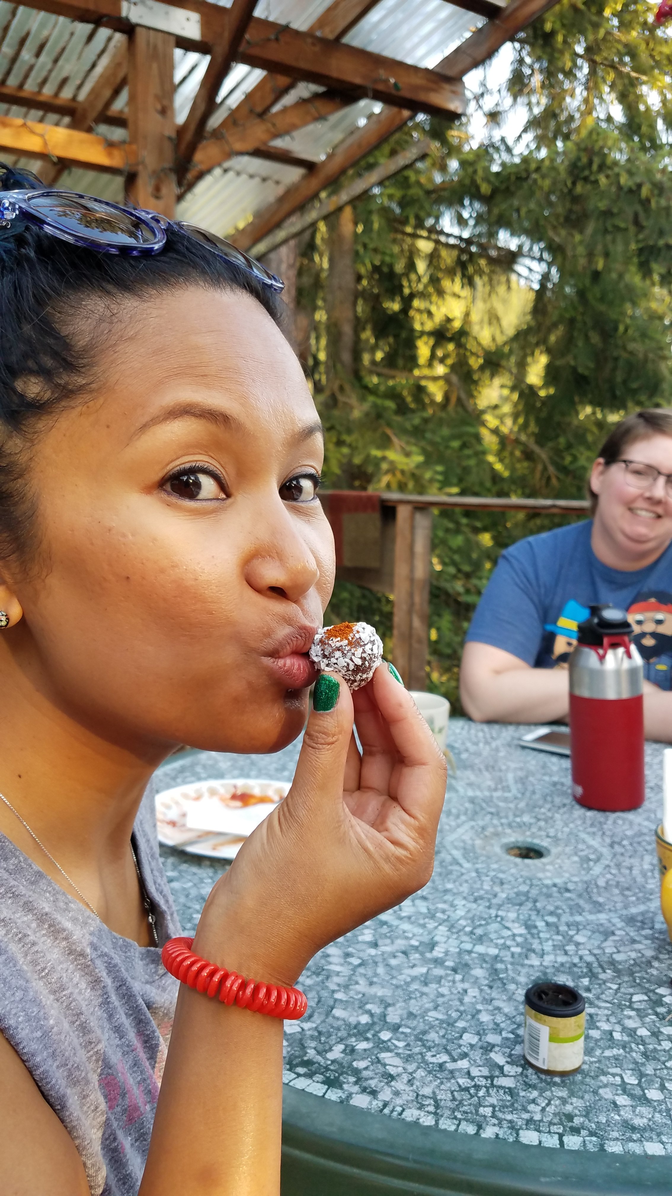 a retreat participant enjoying a healthy chocolate truffle