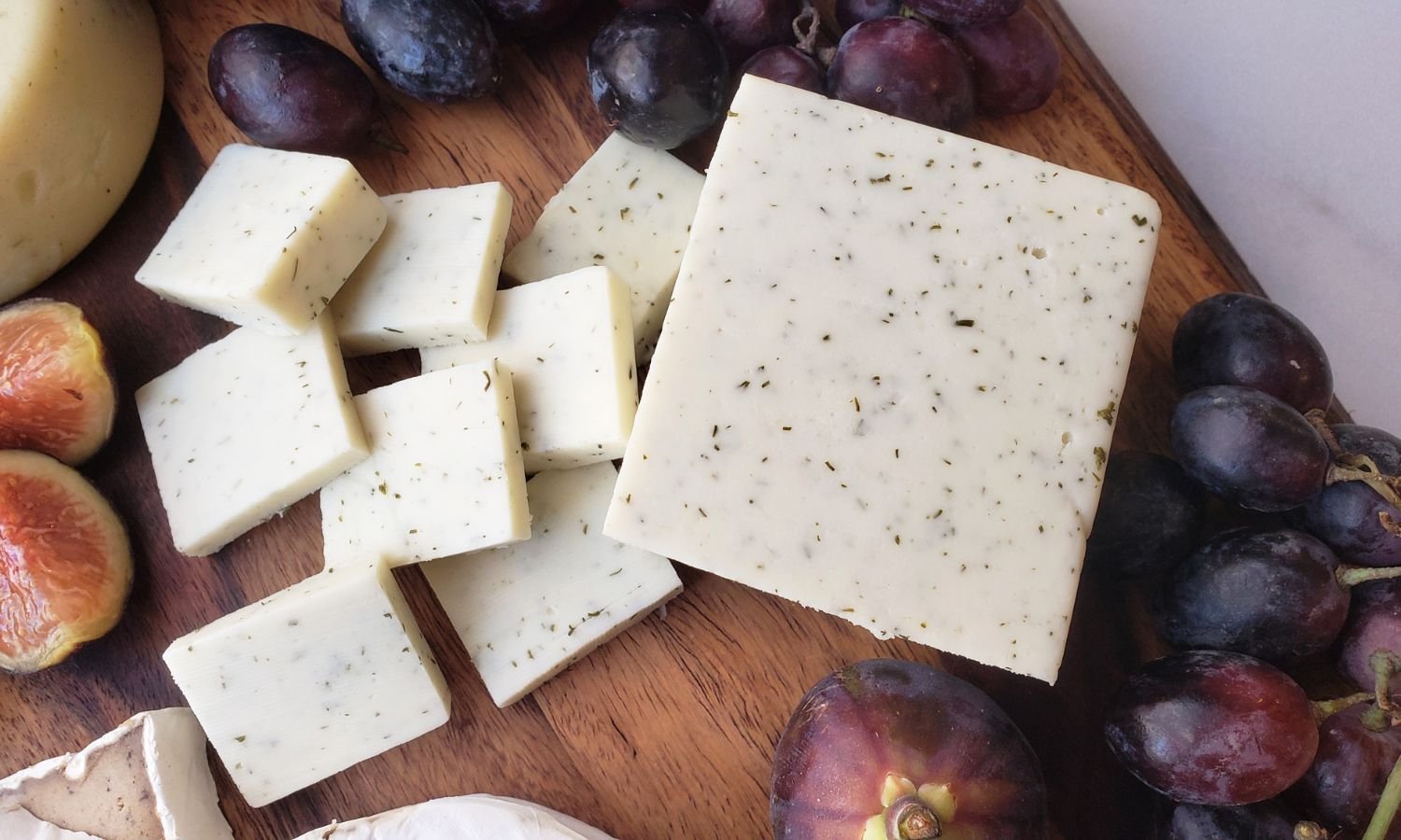 sliced cheese on dairy free cheeseboard