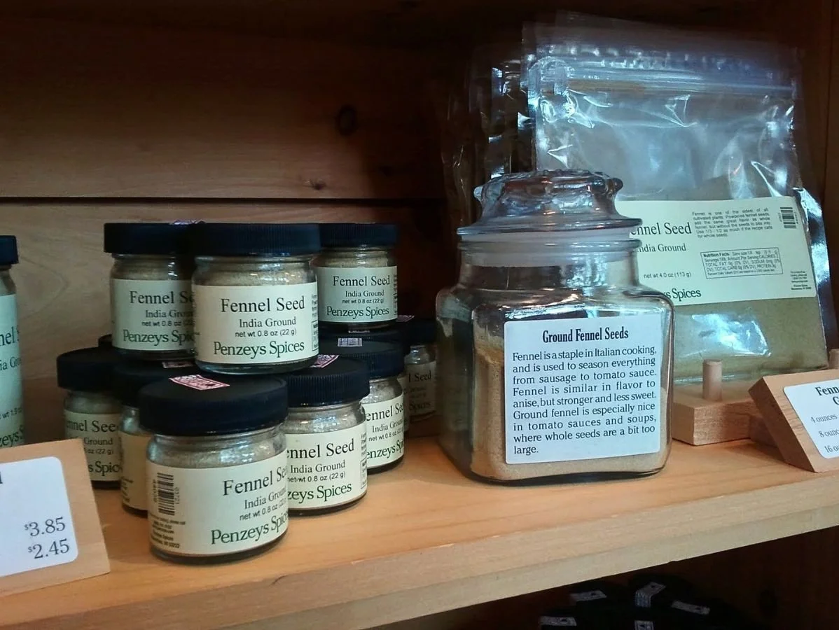Penzeys spices shelf with fennel seed jars