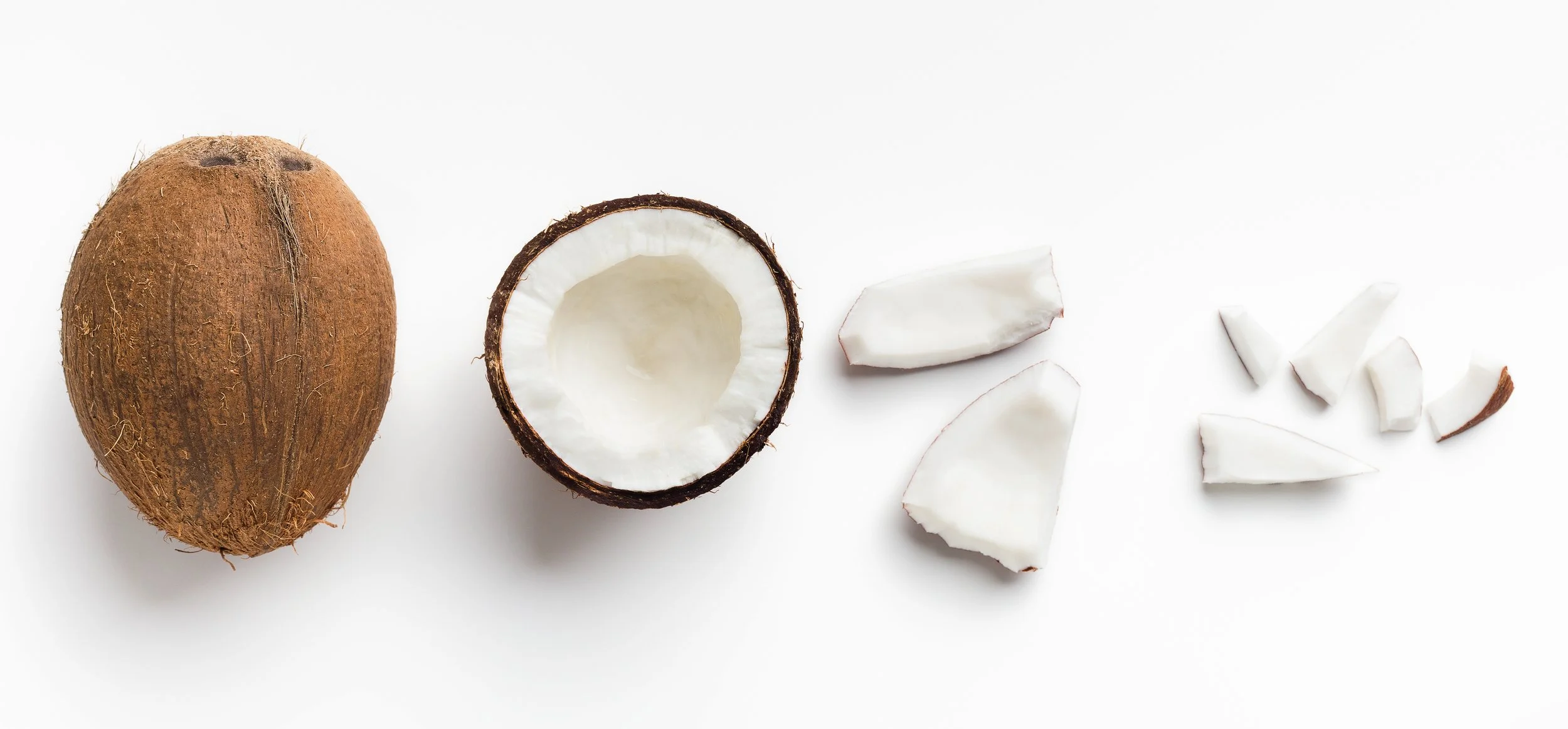 fresh coconut whole and in pieces