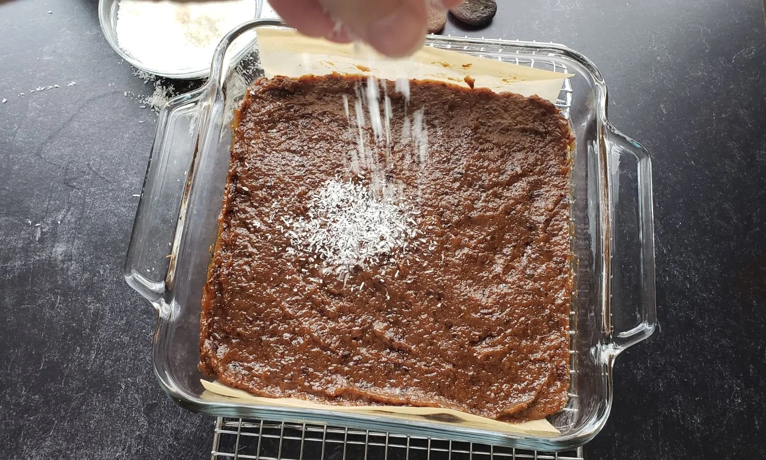 sprinkling on coconut to Apricot and Plum Coconut Bars