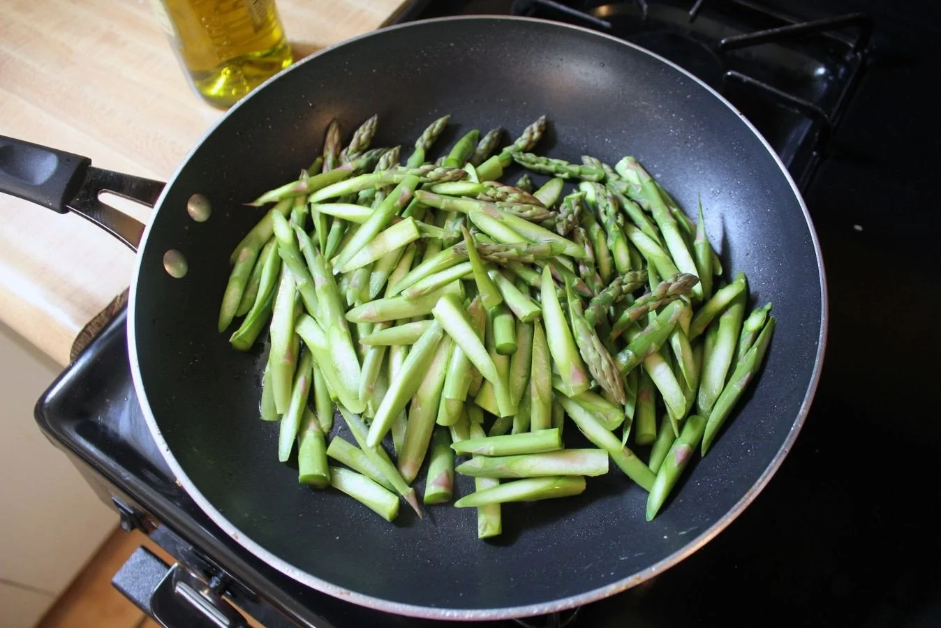 cut asparagus in frying pan