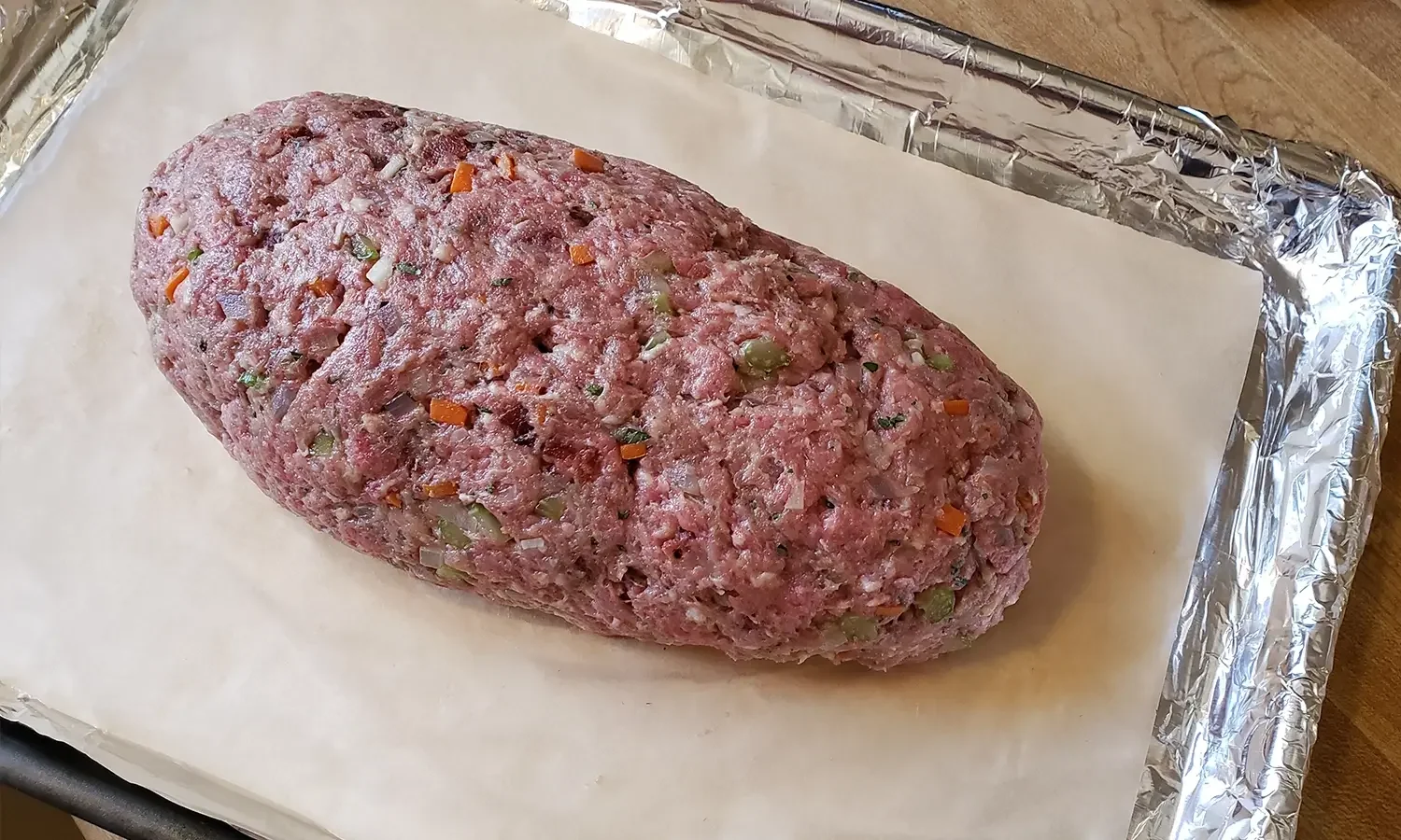 formed meatloaf on baking sheet