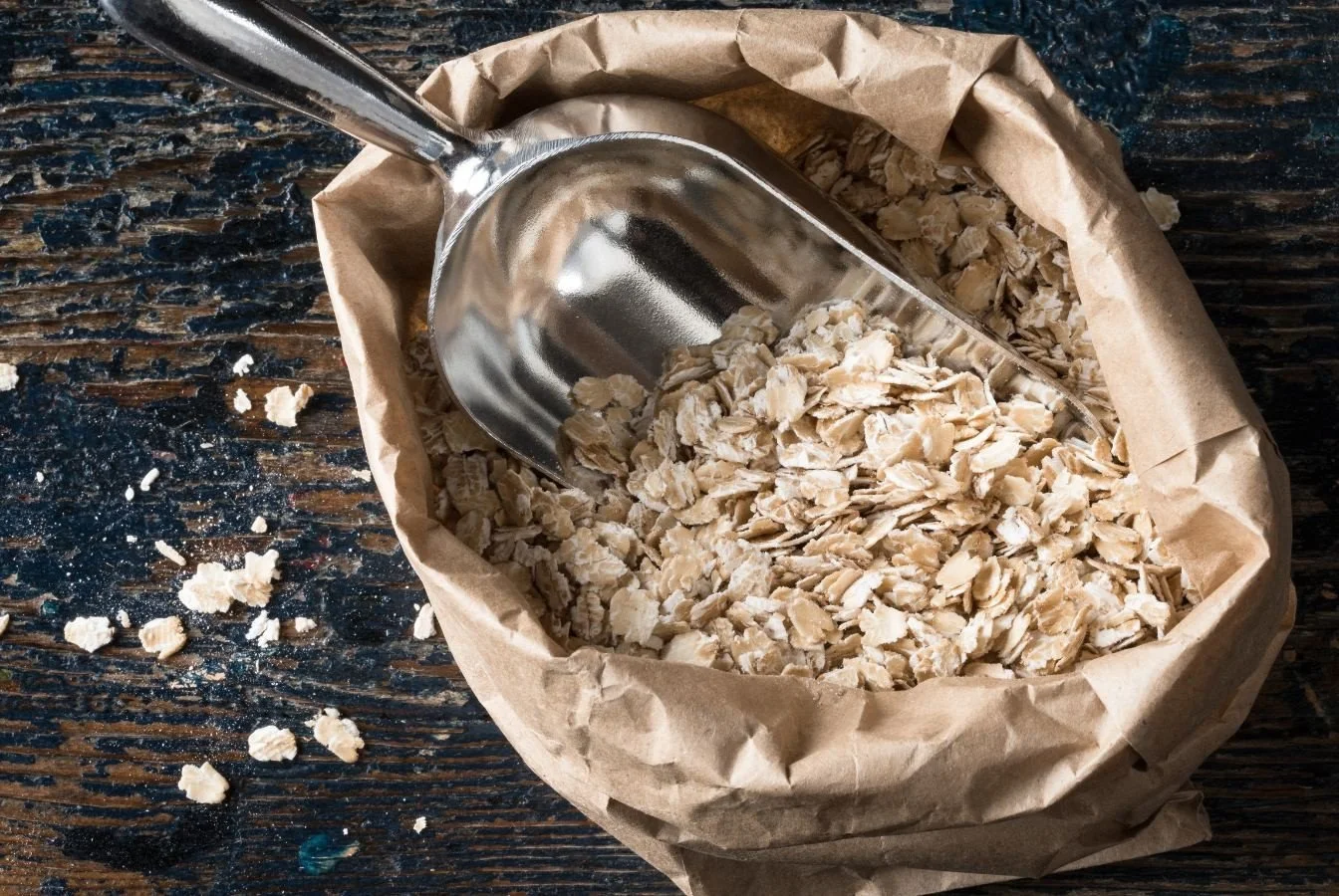 bag of whole rolled oats with scoop