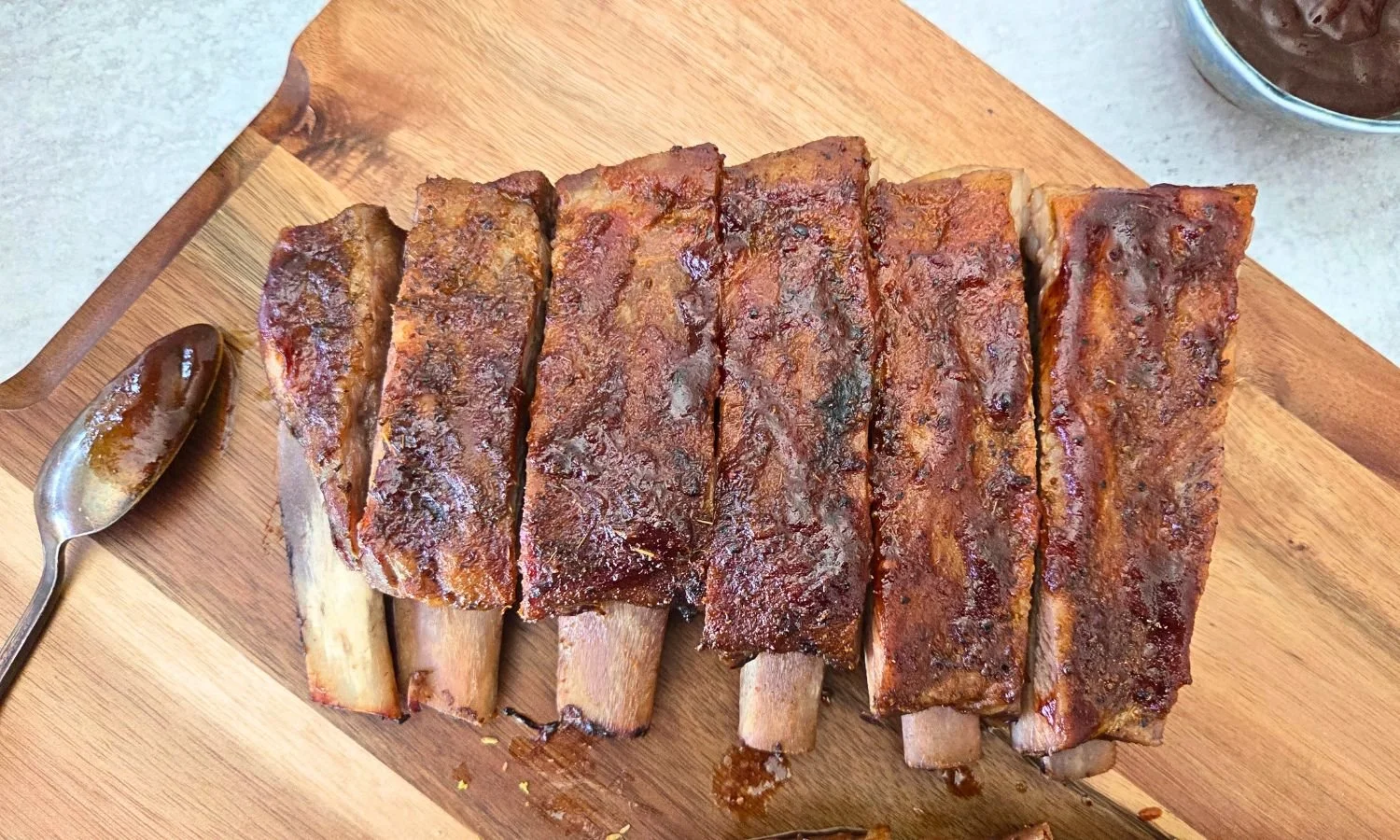 oven baked ribs on cutting board