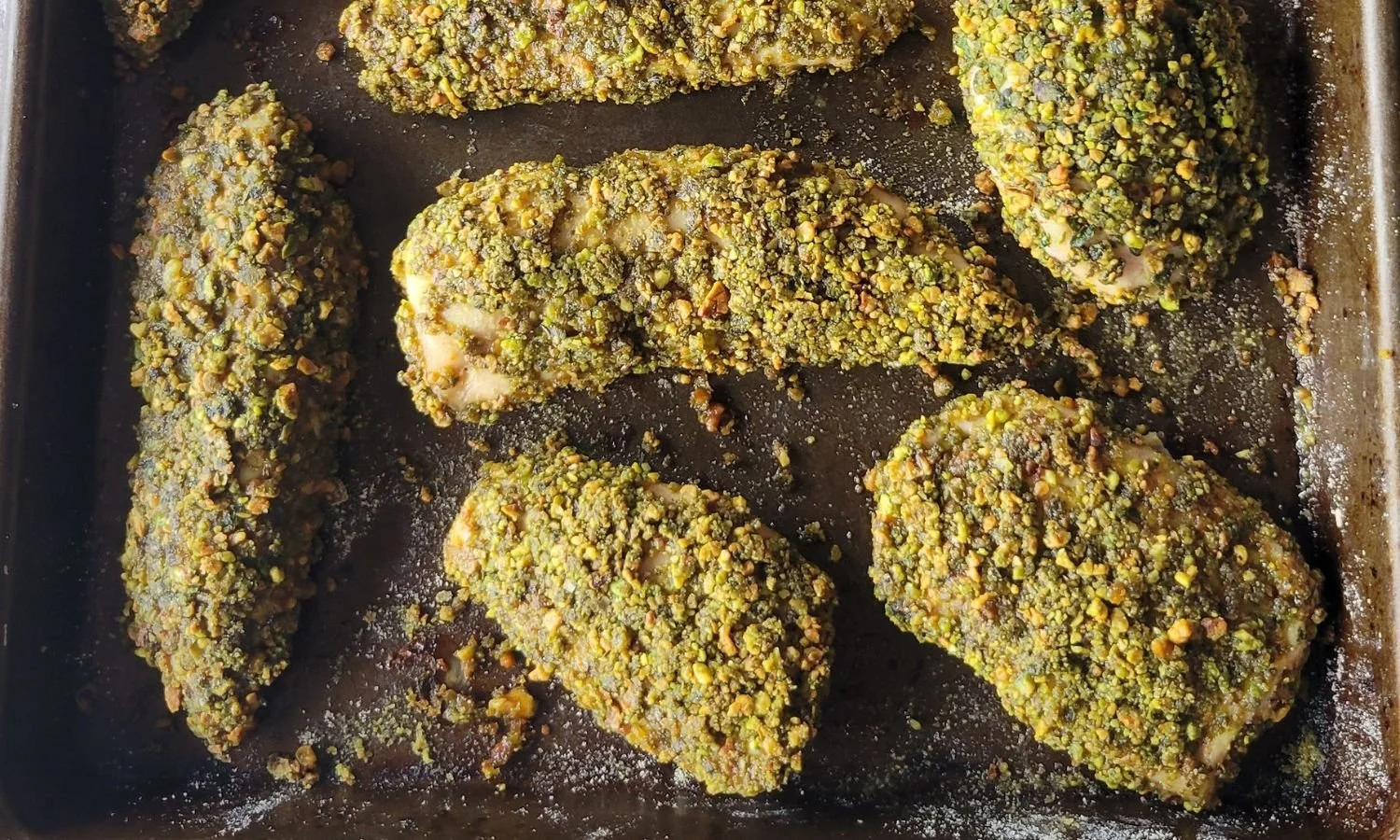 tray of baked pistachio crusted chicken