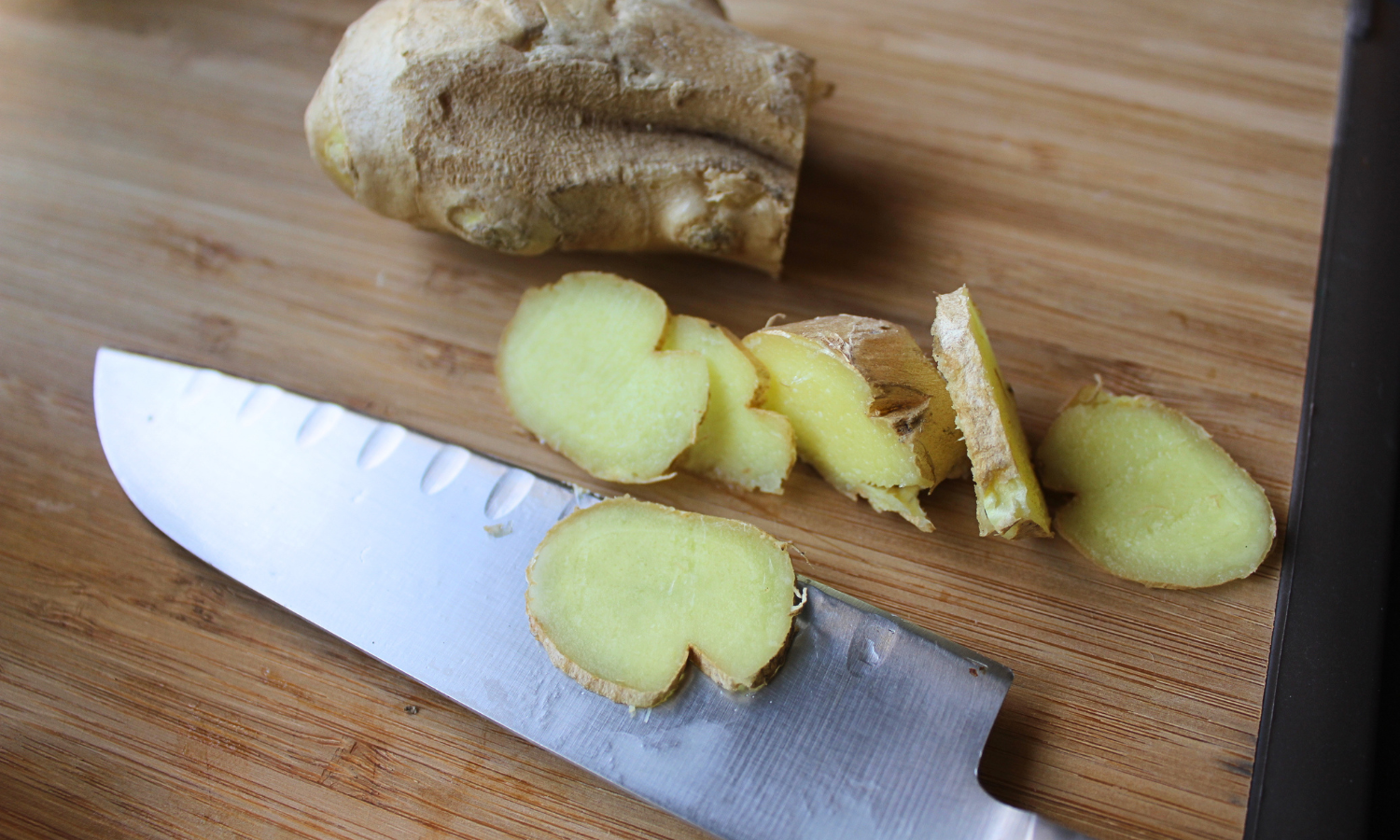 sliced ginger and knife