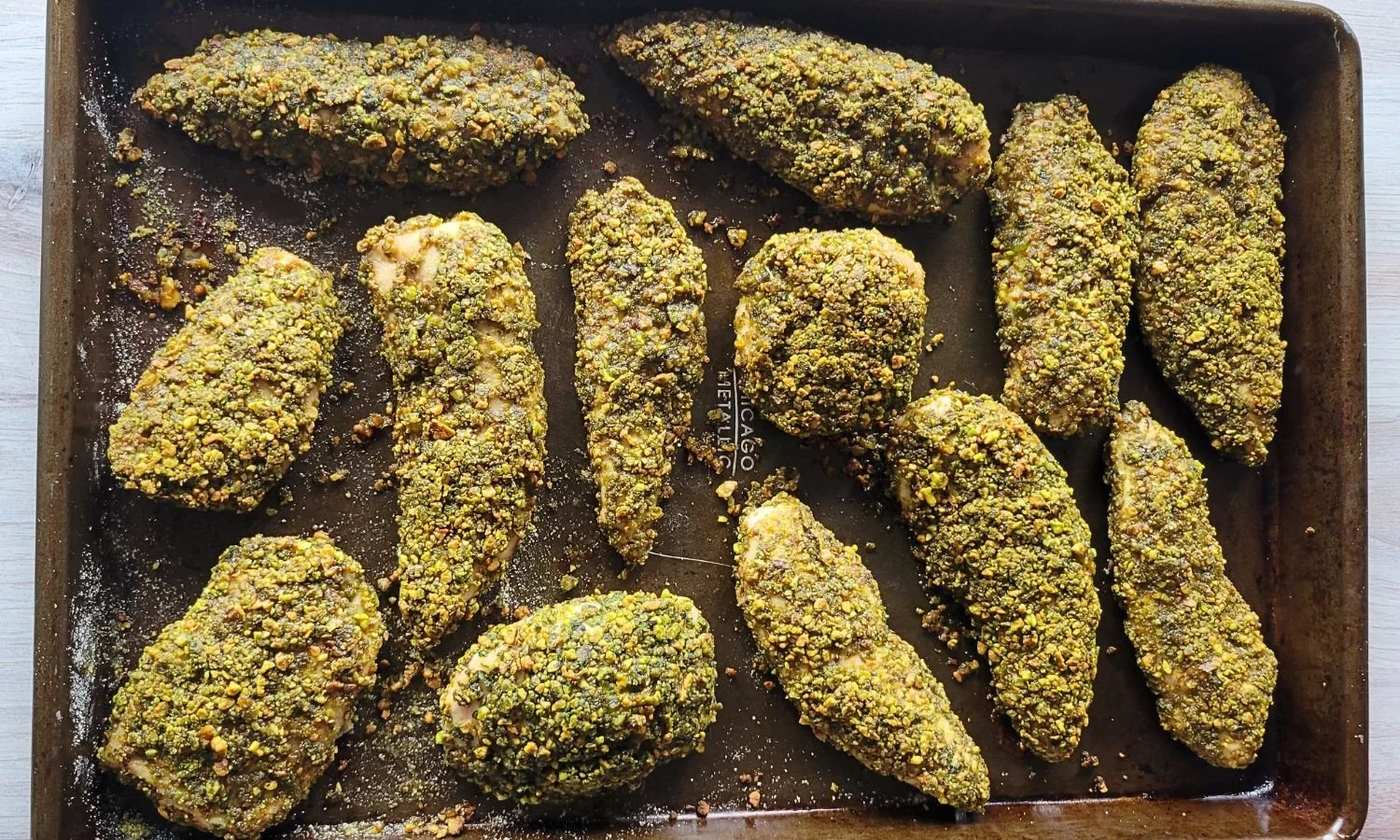 baked pistachio crusted chicken on sheet pan