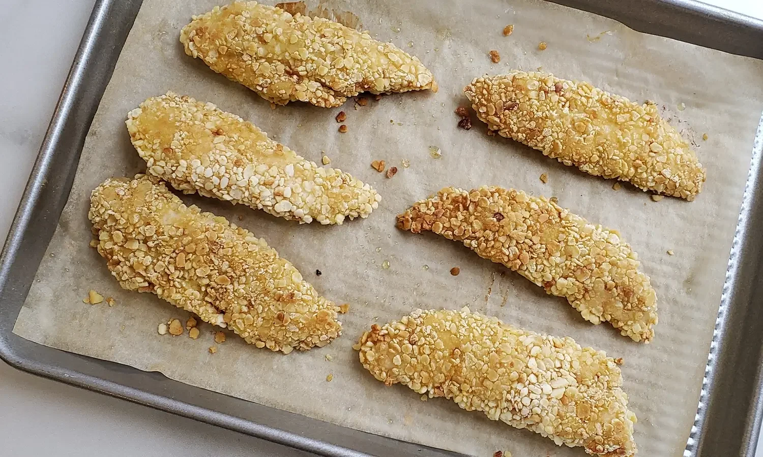 breaded chicken tenders on tray