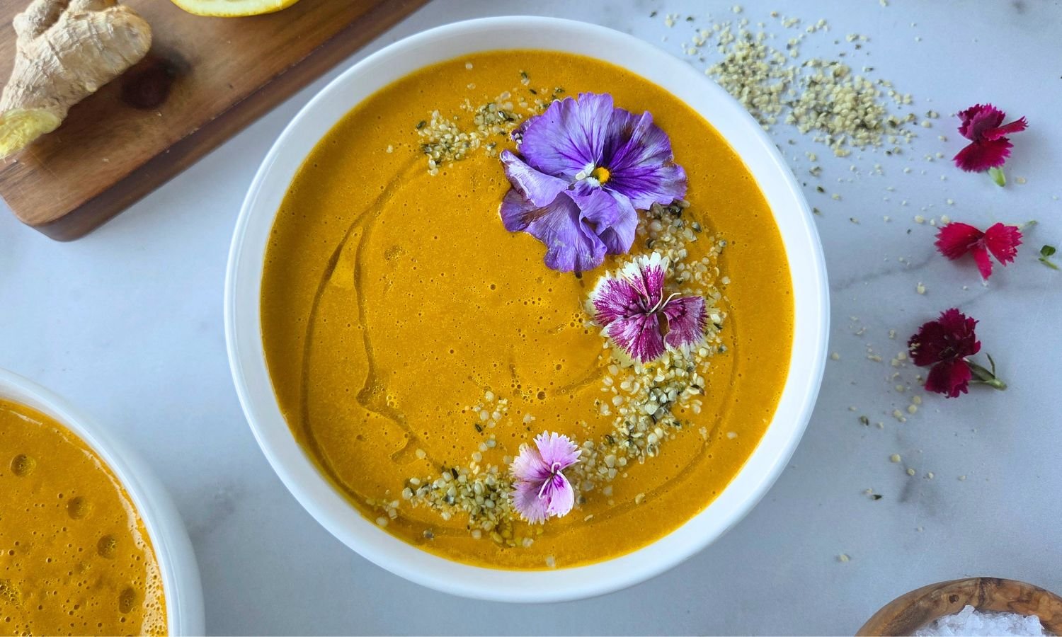 raw carrot ginger soup in bowl