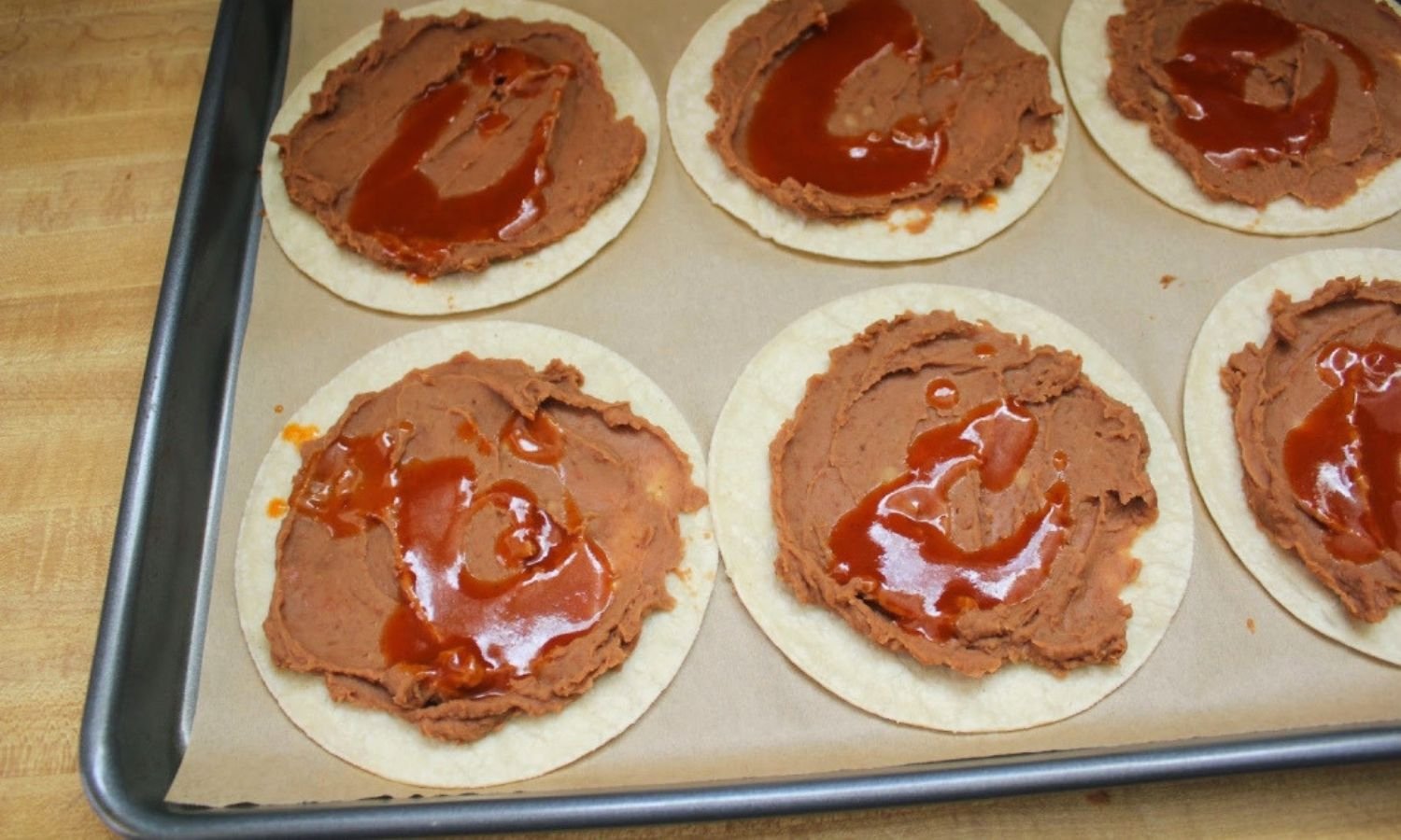 assembling individual huevos rancheros ingredients