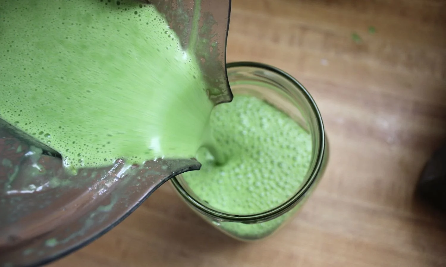 Green Smoothie pouring into a glass