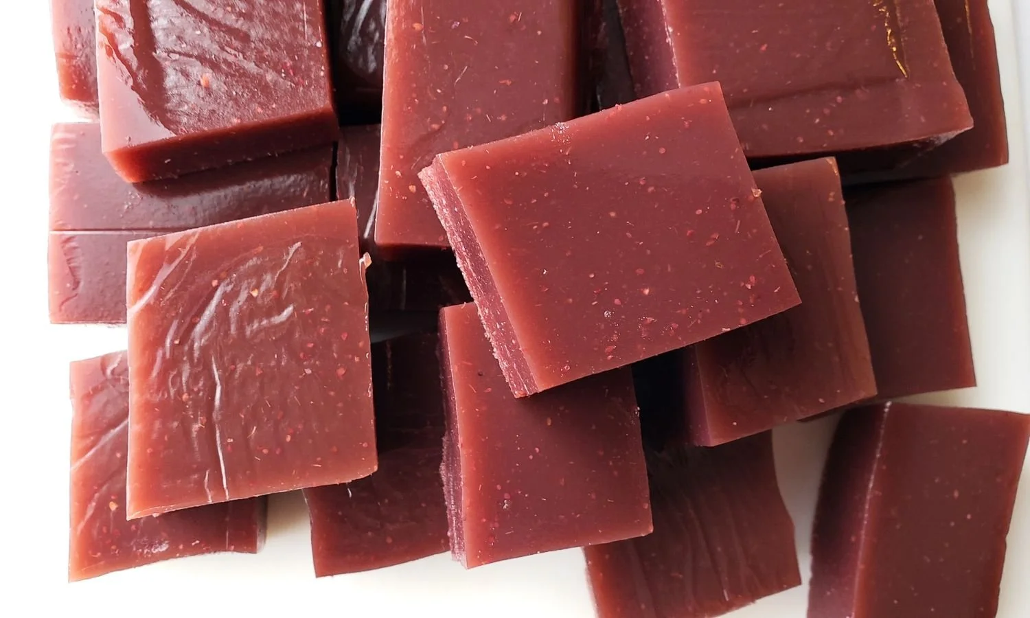 berry gelatin squares on cutting board