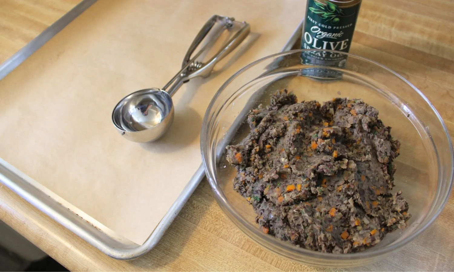 bowl of mashed black bean and lentil cake ingredients