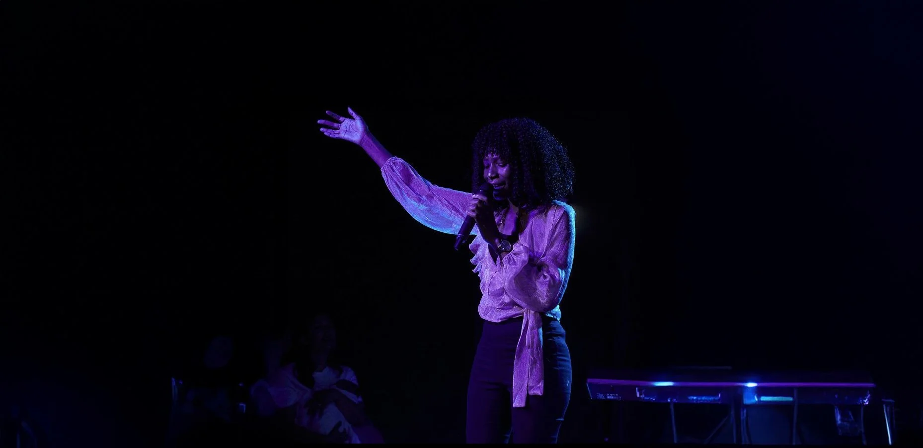 Chiemezie Nwosu singing raising hands in the air