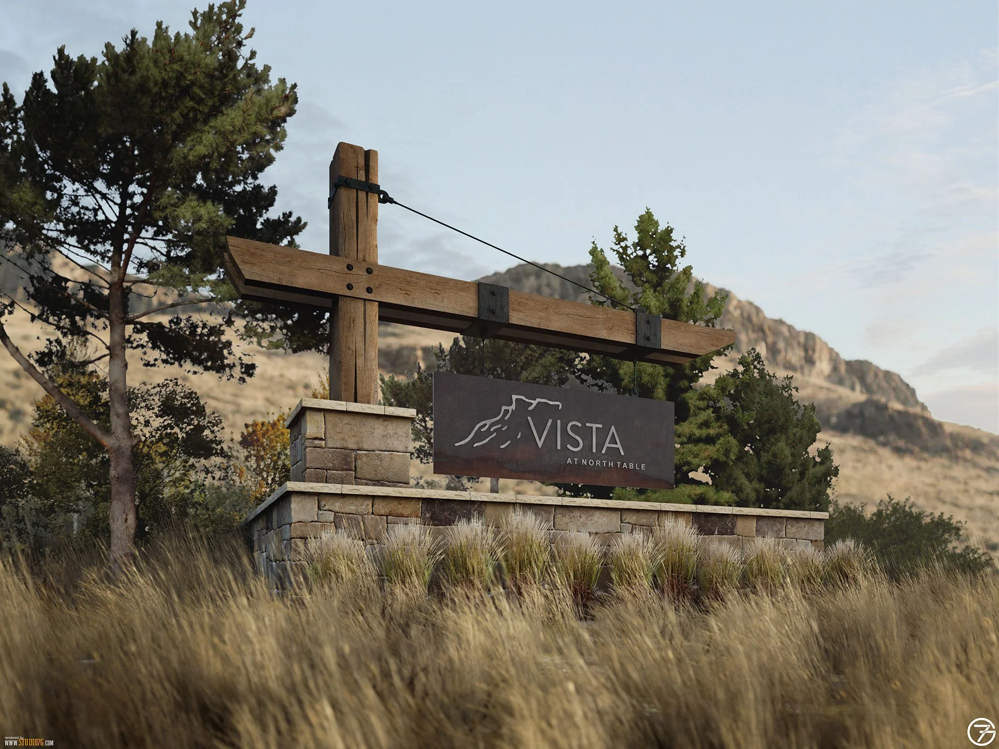 A sign for Vista, a North Table, with a mountain landscape in the background and trees around it, set in a grassy outdoor area.