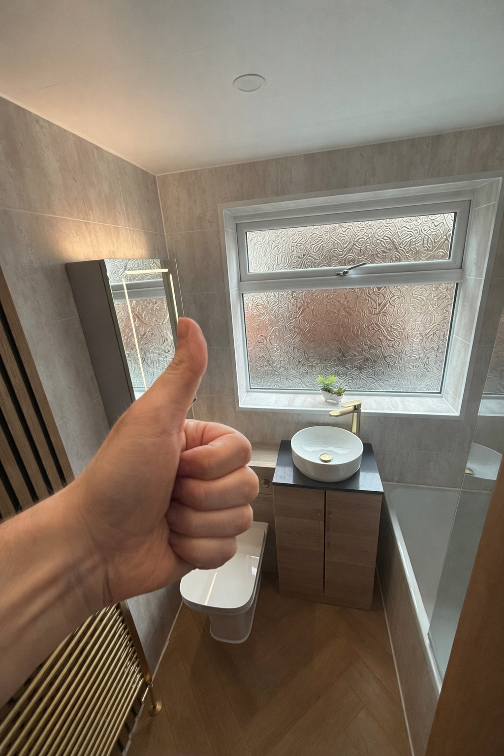 Customer satisfaction after bathroom renovation in Manchester with modern PVC wall panels