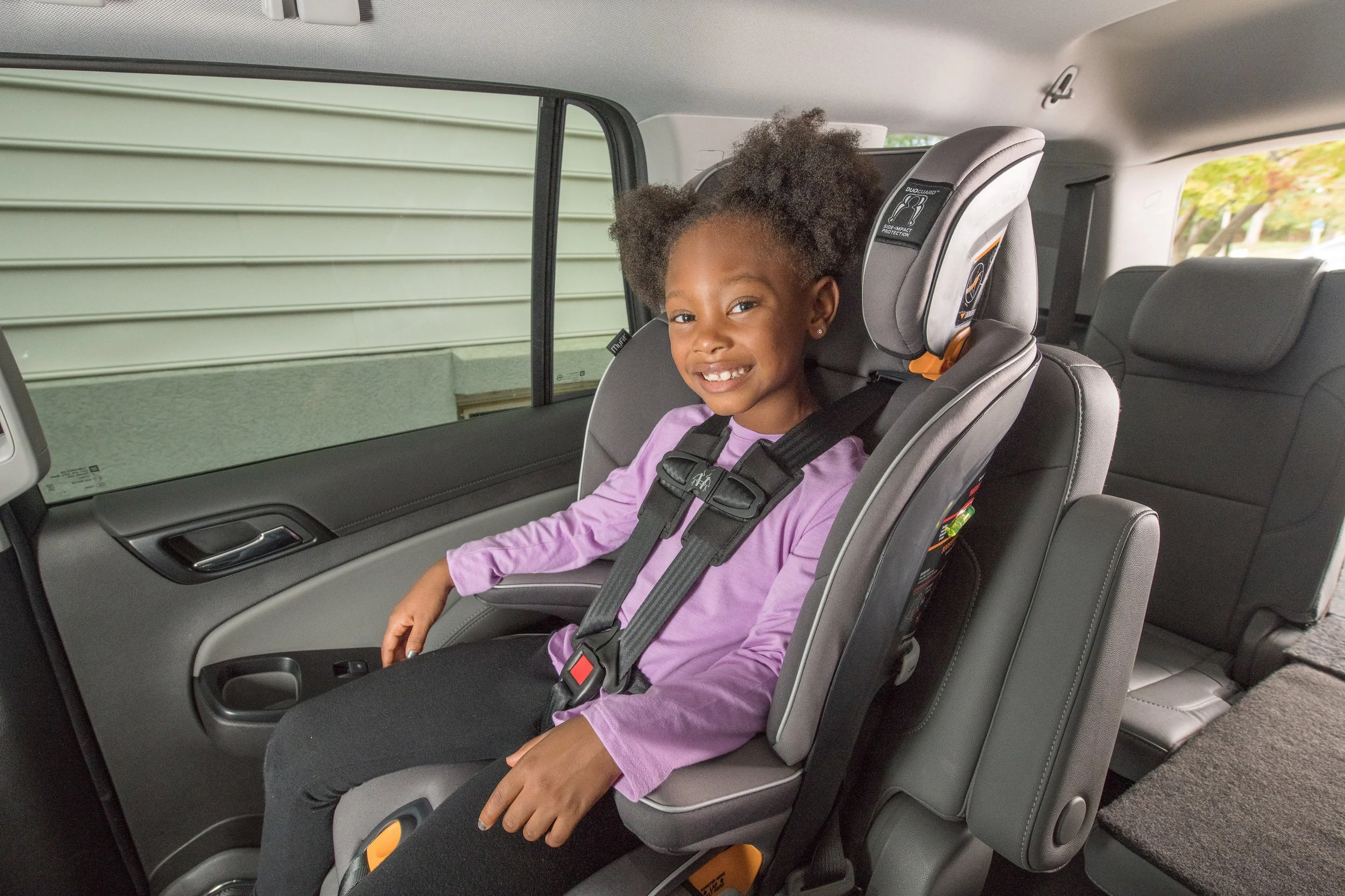 Young girl in forward facing car seat