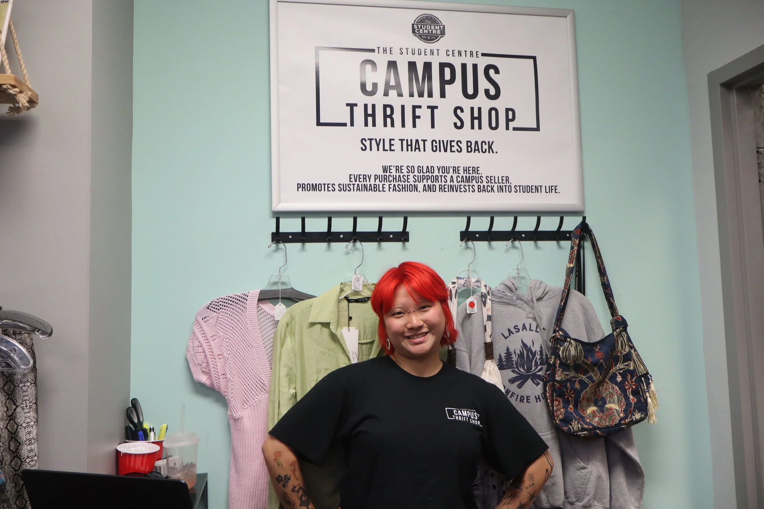  Graduate student Fei Qin is one of the sales associates at the Campus Thrift Shop.  | Arran Christie / LANCE 
