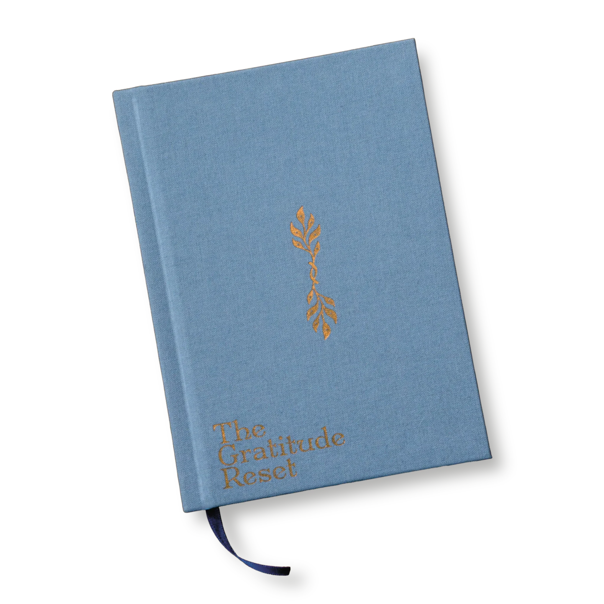 A closed blue hardcover book titled "The Gratitude Reset" with a gold decorative leaf design on its cover; the book has a blue fabric-like cover and a navy blue ribbon bookmark.