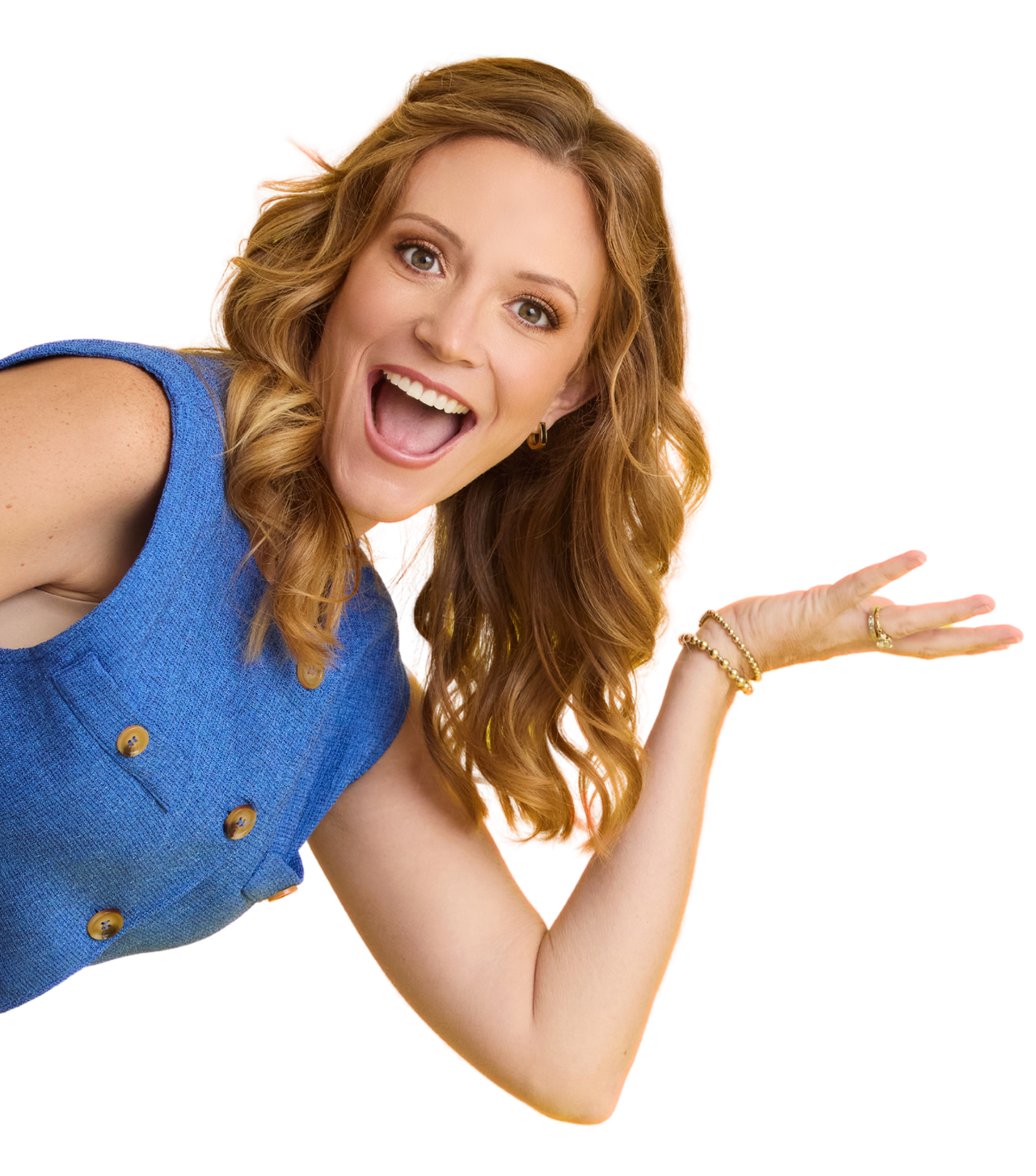 A woman with long red hair, wearing a blue sleeveless top, smiling and gesturing with her right hand.