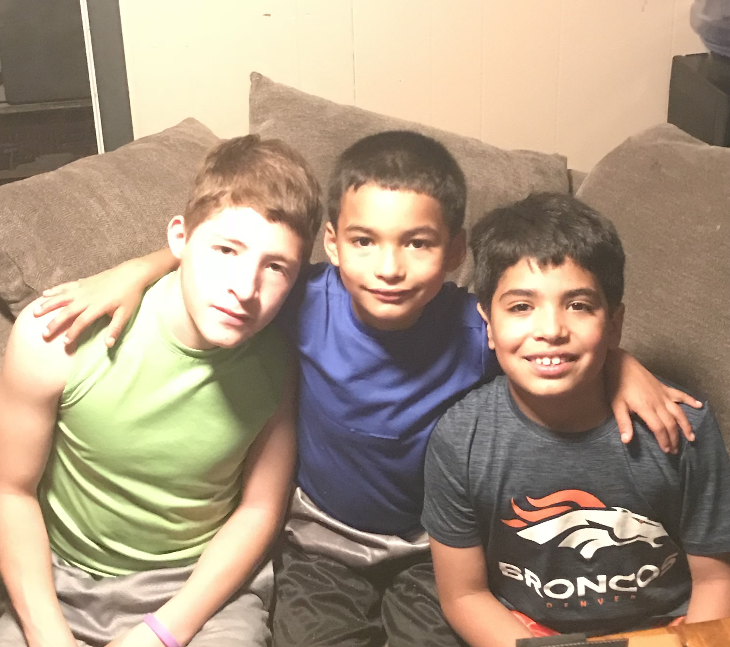 Founder Nehemiah Castillo sitting with his two brothers.