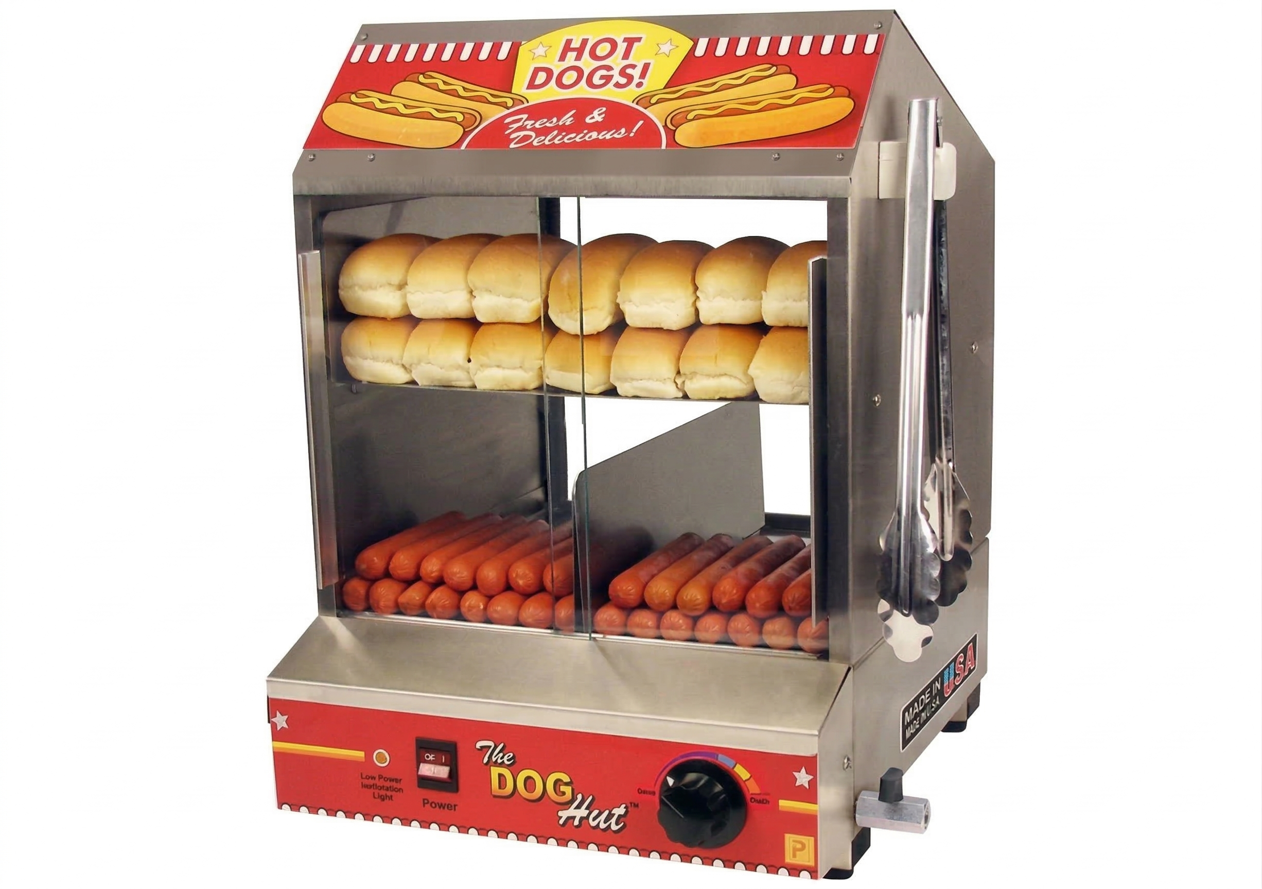 A stainless steel hot dog warmer with three shelves holding hot dog buns and sausages. The top has a red and yellow sign reading "Hot Dogs!" and "Fresh & Delicious!" The bottom front panel is decorated with stars and stripes, with a power switch and temperature dial on the side.