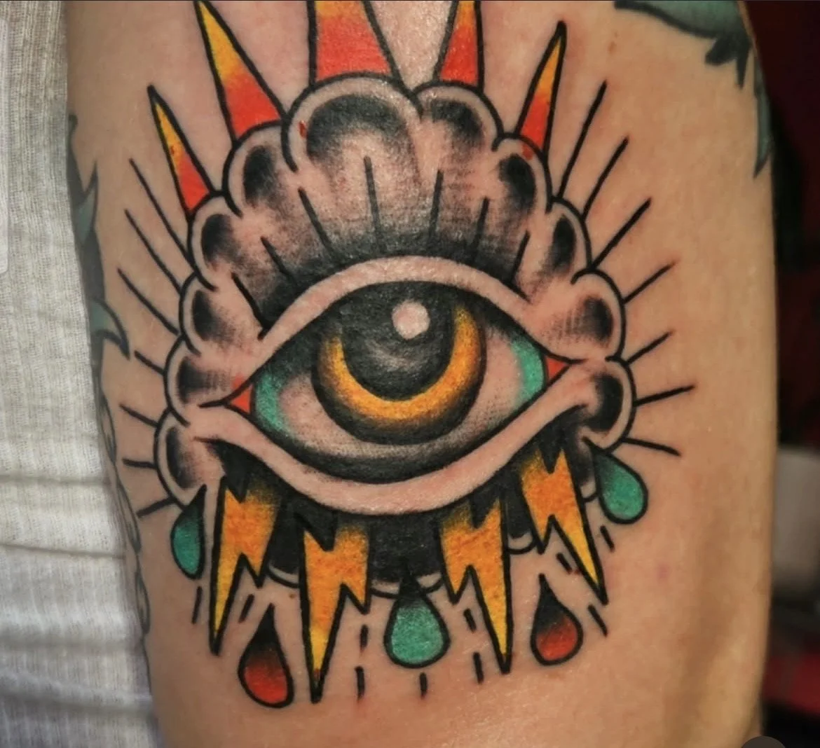 Color American traditional eye of the storm tattoo