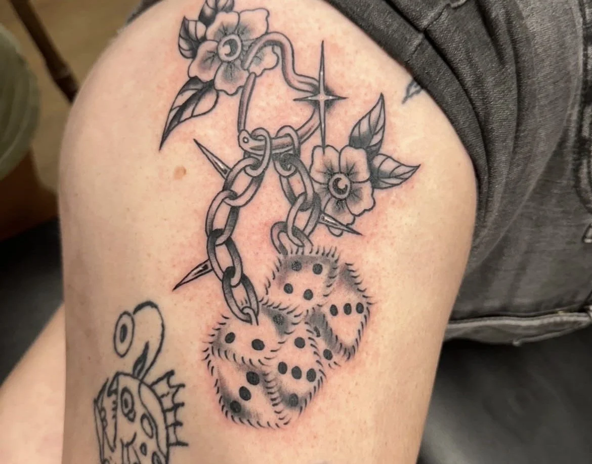 Black and grey fuzzy hand cuff tattoo