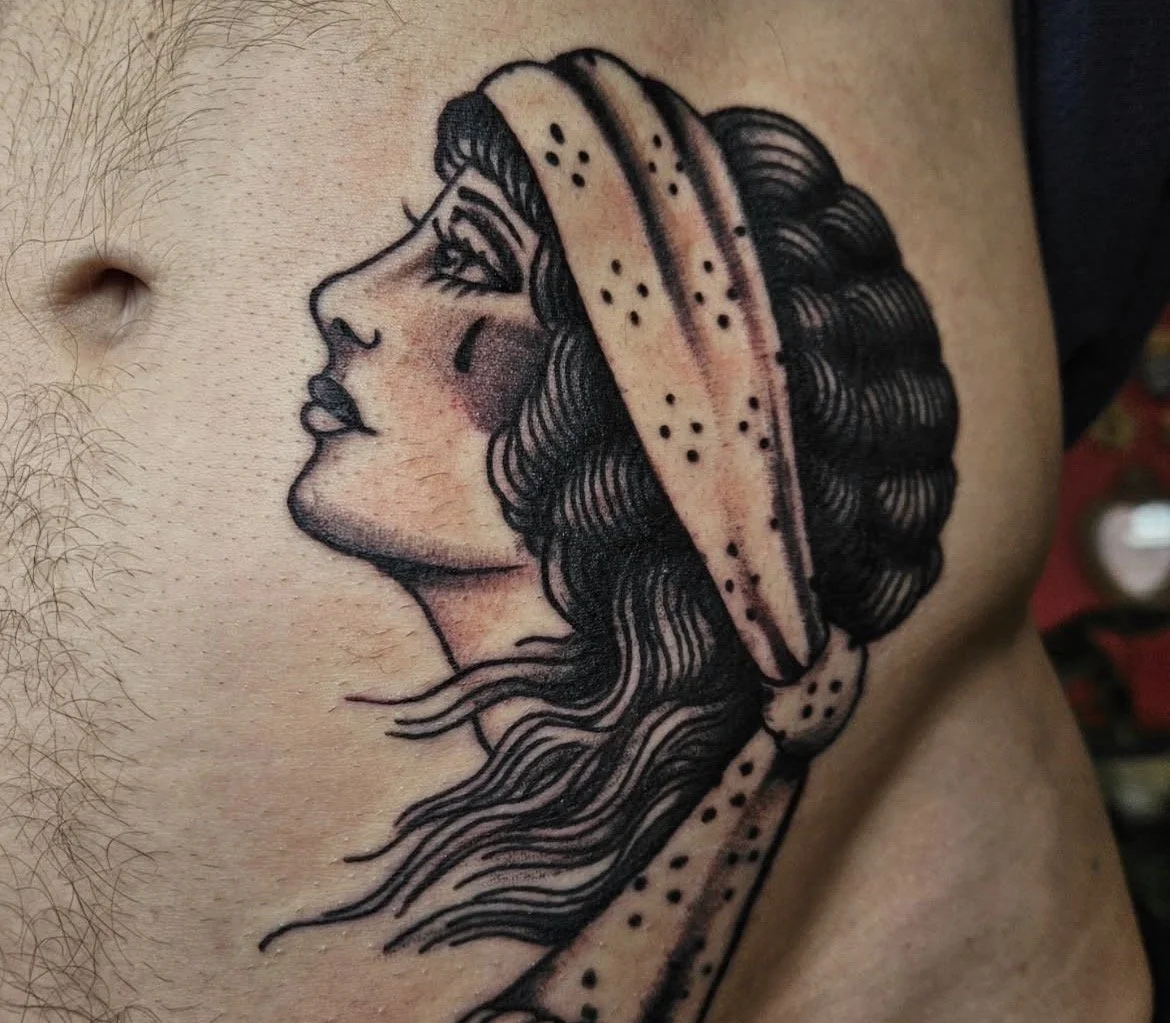 black and grey  american traditional lady head tattoo