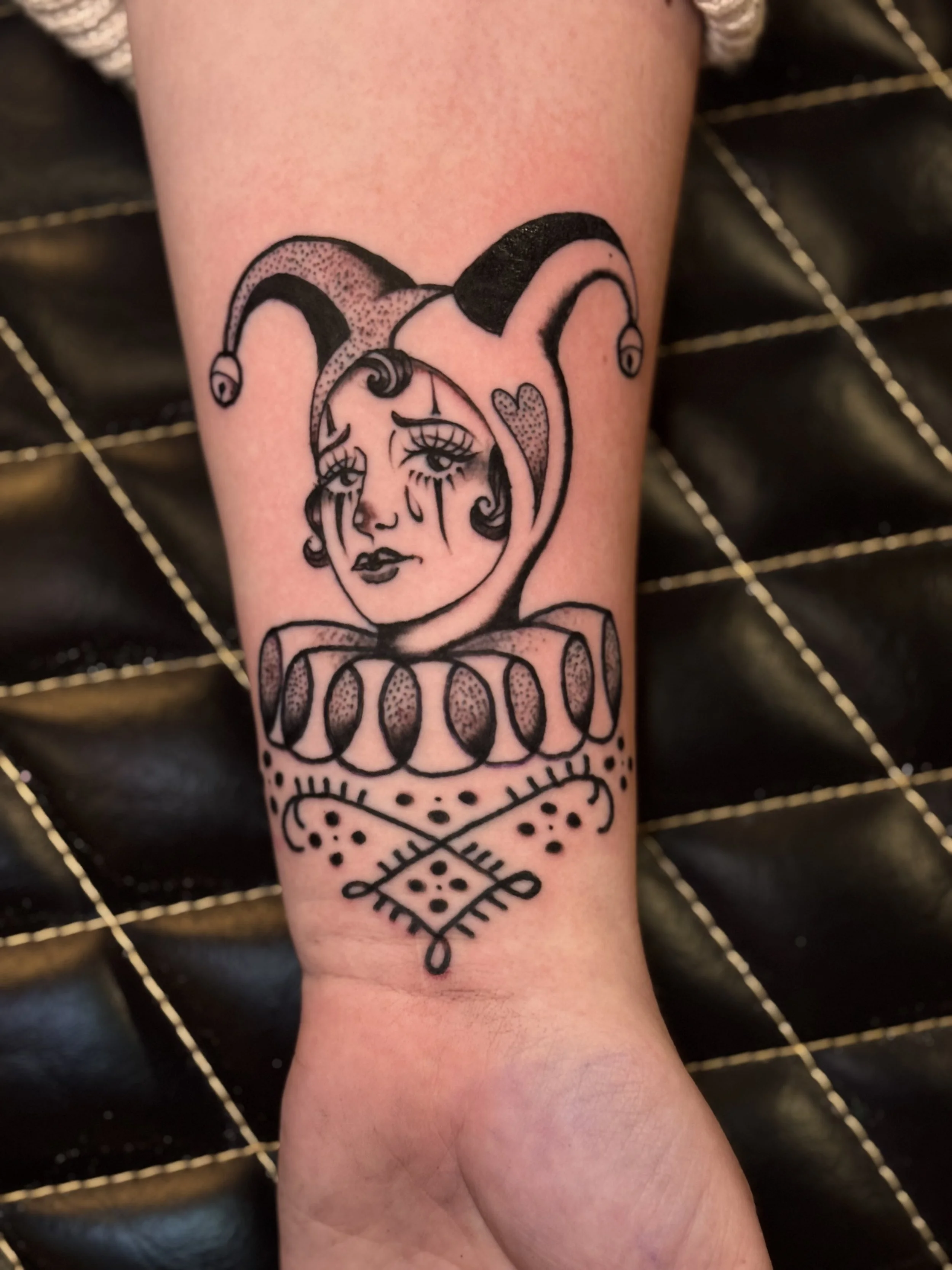 black and grey crying clown girl tattoo