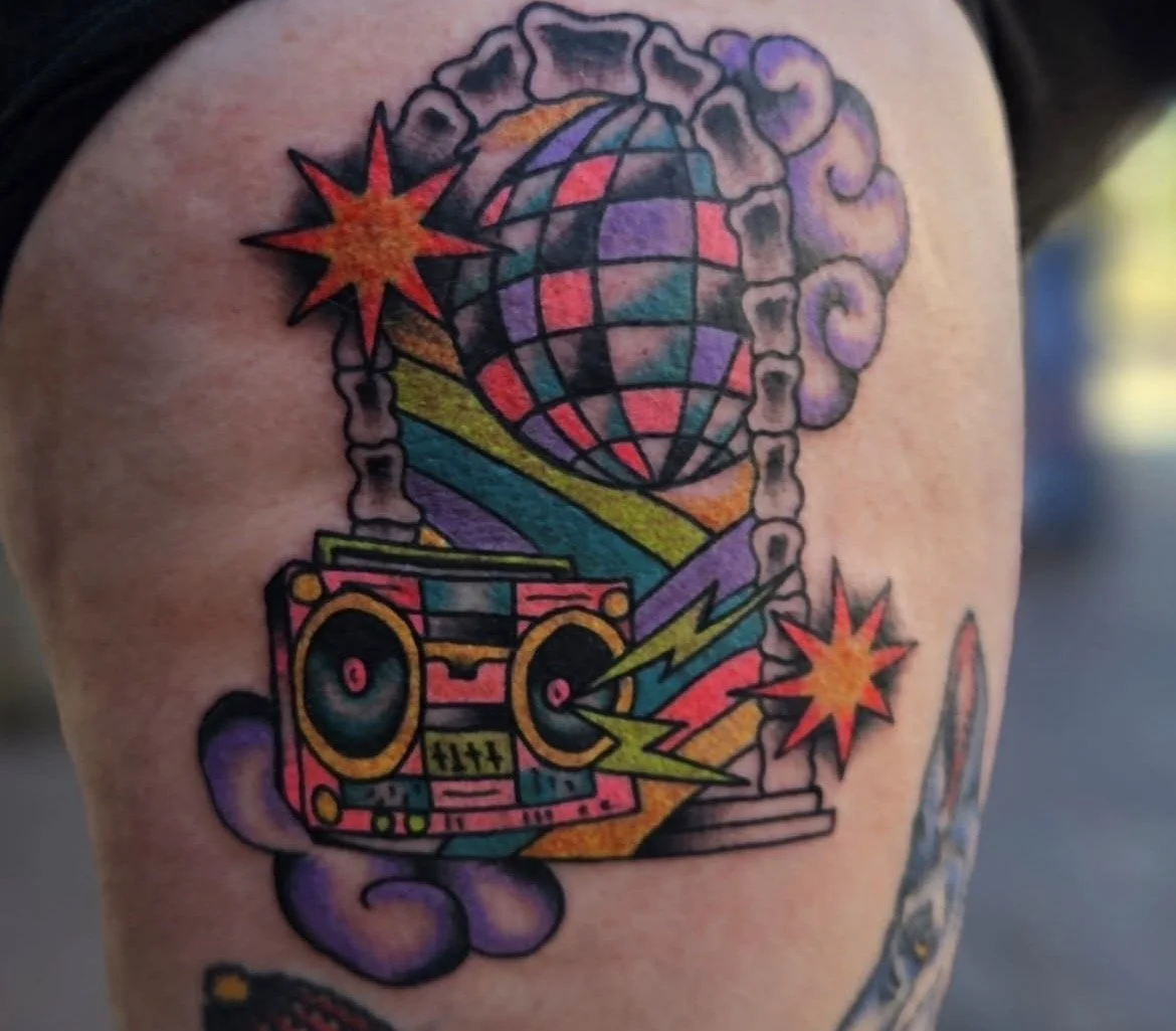 Colorful 80s portal tattoo with boombox and disco ball
