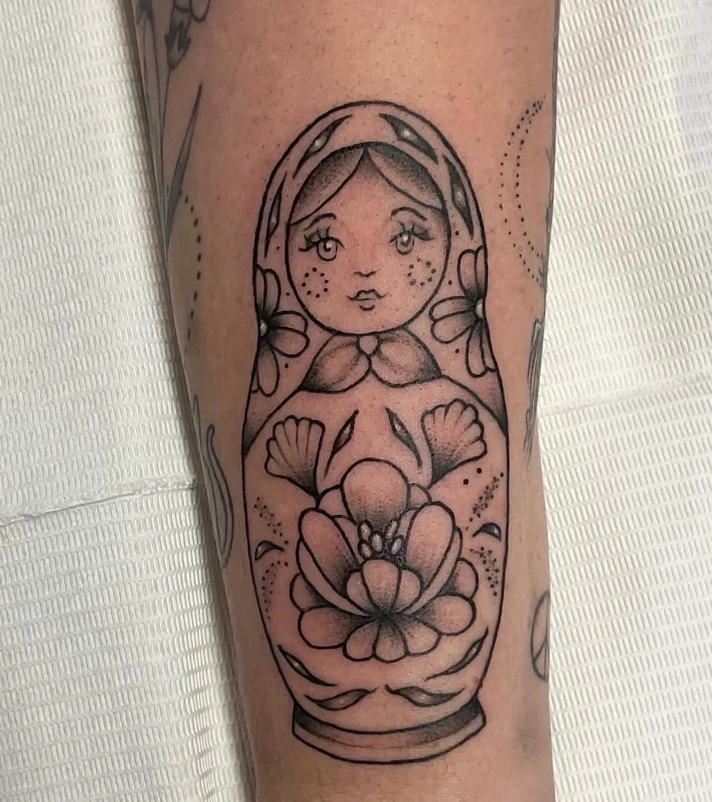 fineline black and grey russian doll tattoo