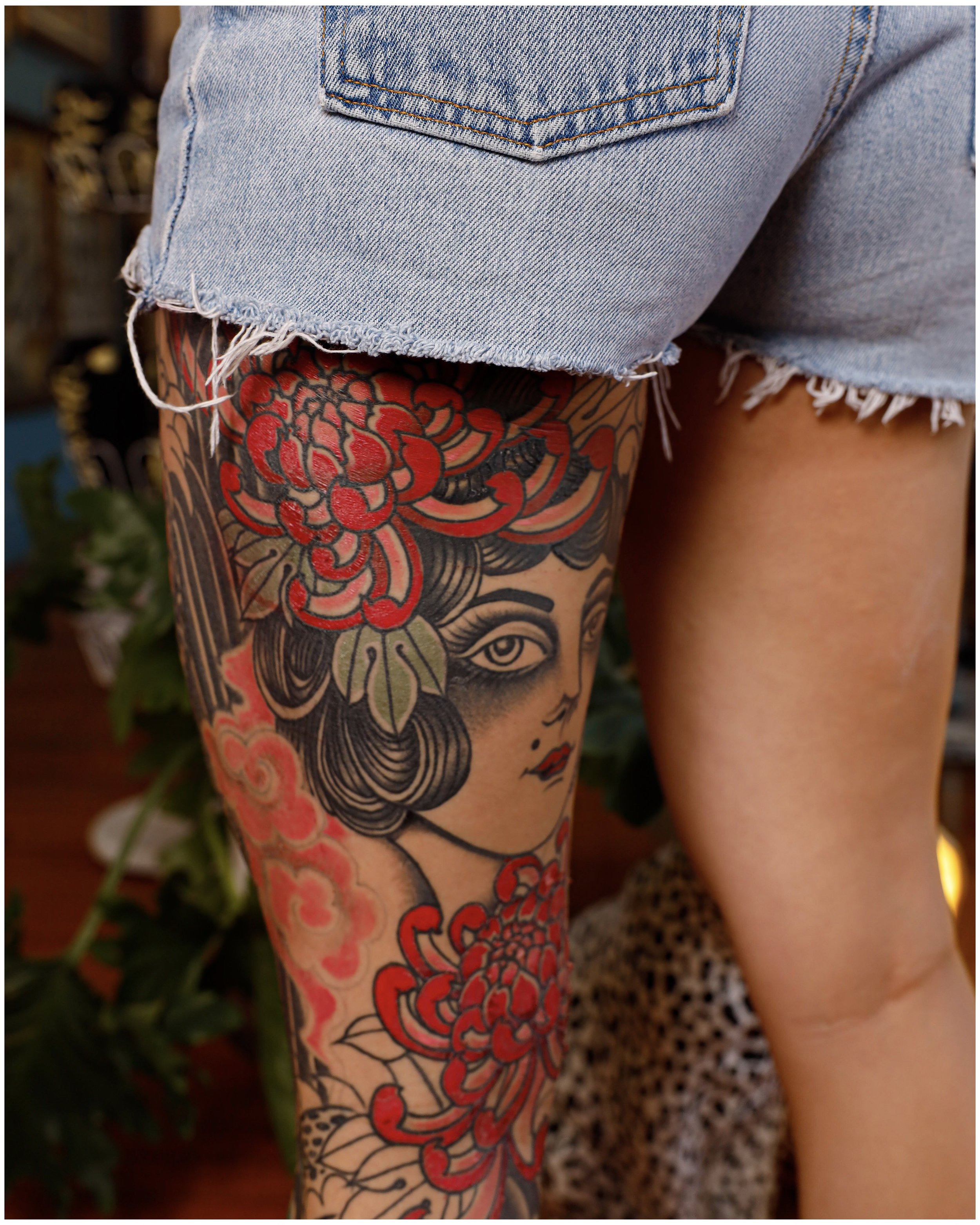 lady head leg sleeve in american traditional style of tattooing