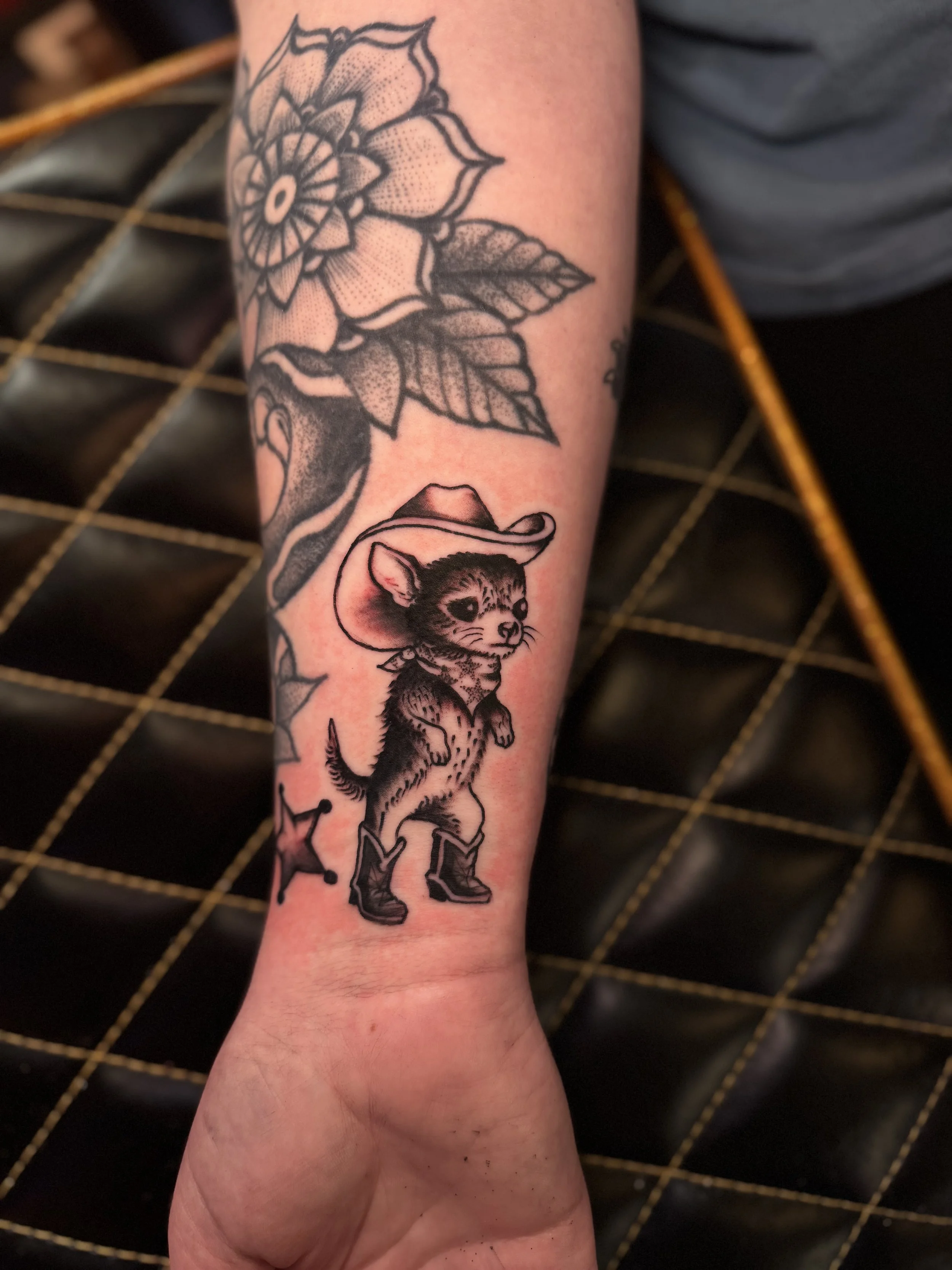 funny pet portrait tattoo of a dog dressed as a cowboy