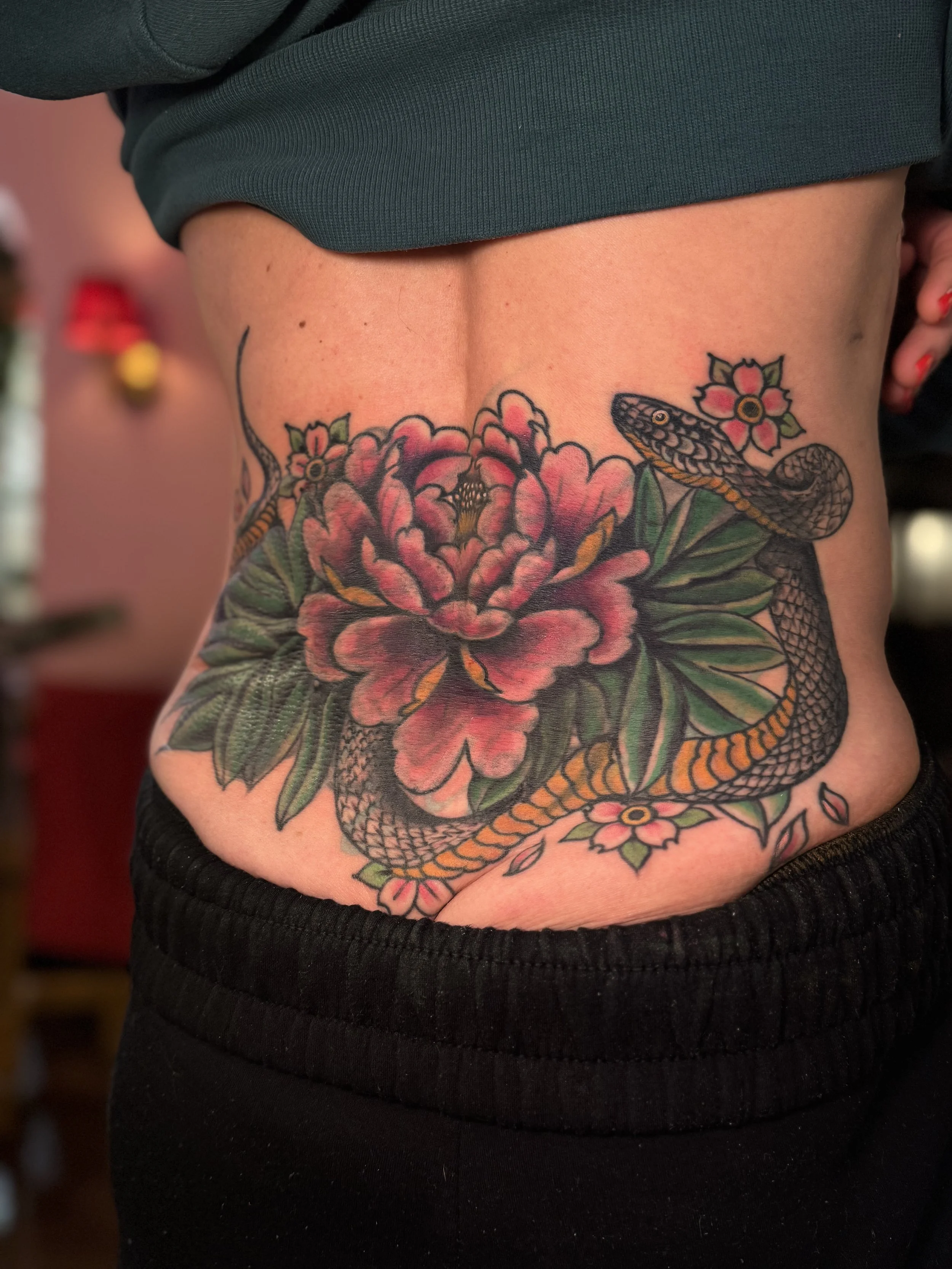 Cover up tattoo with snake and flower