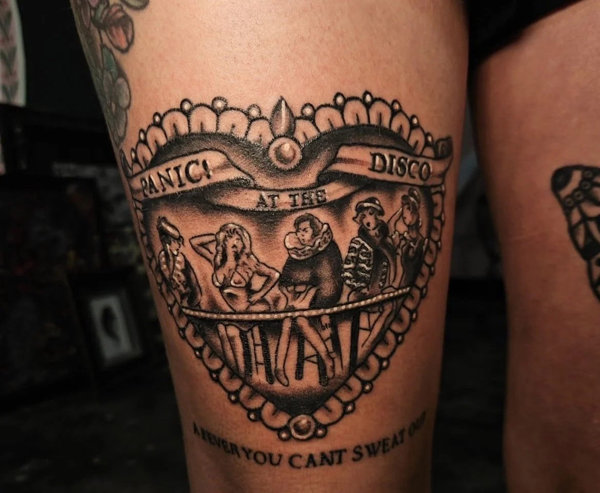 black and grey panic! at the disco thigh tattoo