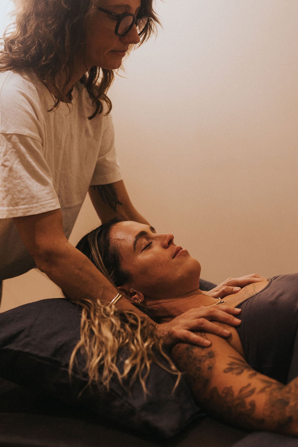 client laying with eyes closed, receiving treatment